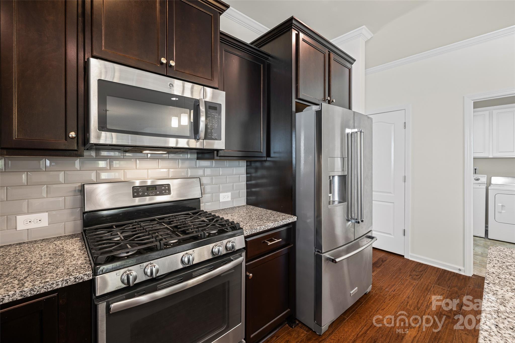 1214 Brookcrest Lane Fort Mill, SC 29708 - Photo 11 of 41 a kitchen with stainless steel appliances granite countertop a stove microwave and refrigerator