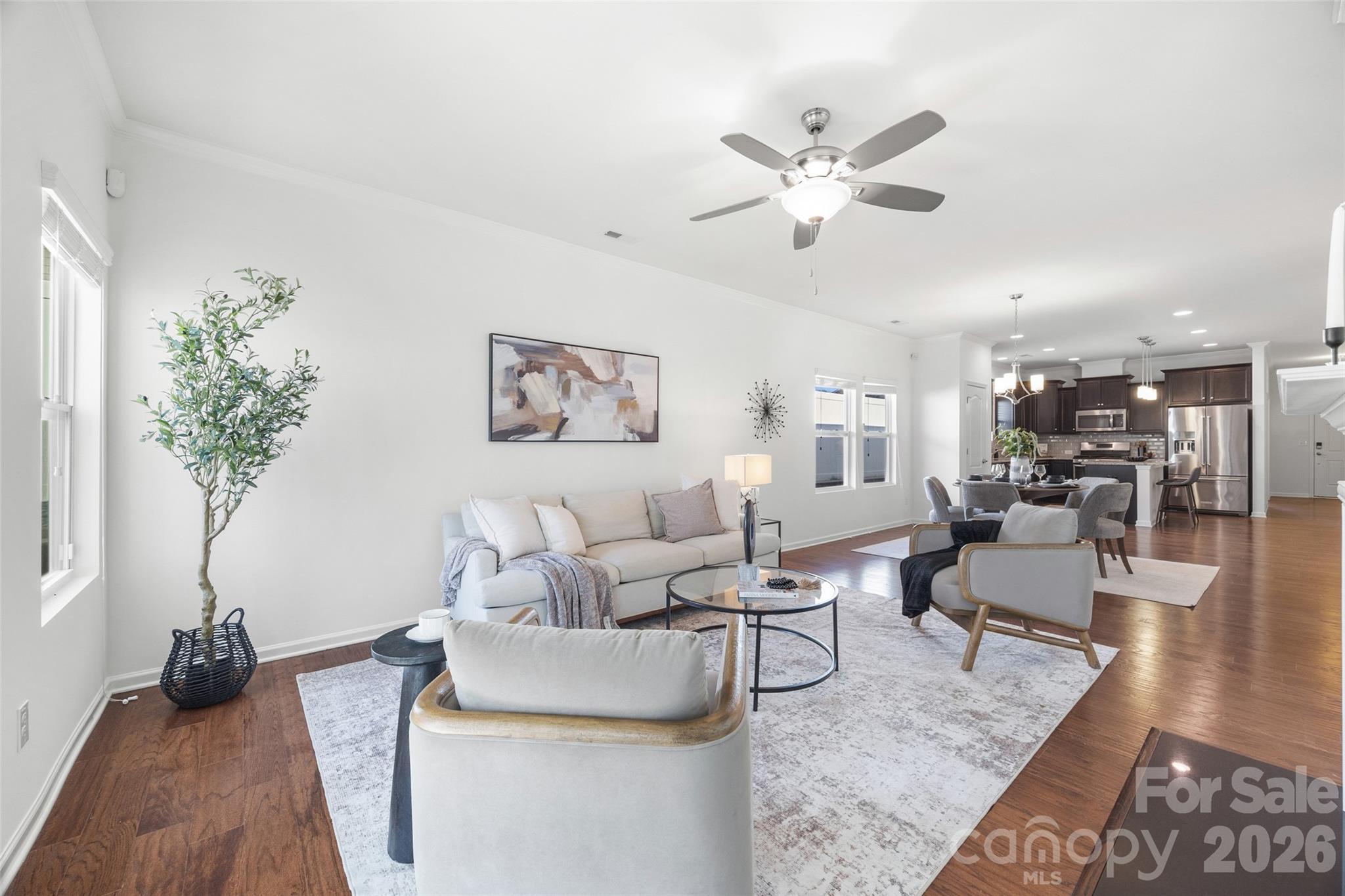 1214 Brookcrest Lane Fort Mill, SC 29708 - Photo 18 of 41 a living room with furniture and a chandelier