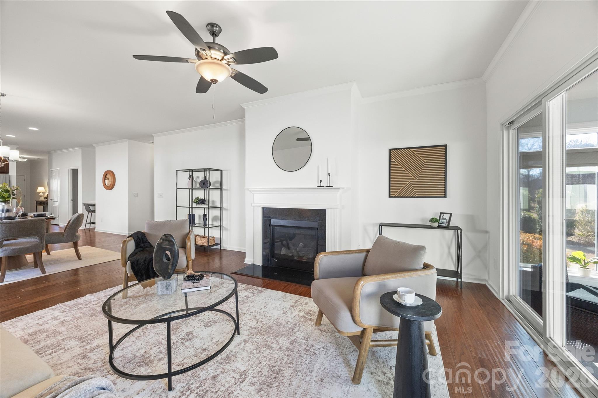 1214 Brookcrest Lane Fort Mill, SC 29708 - Photo 19 of 41 a living room with furniture a fireplace and a table