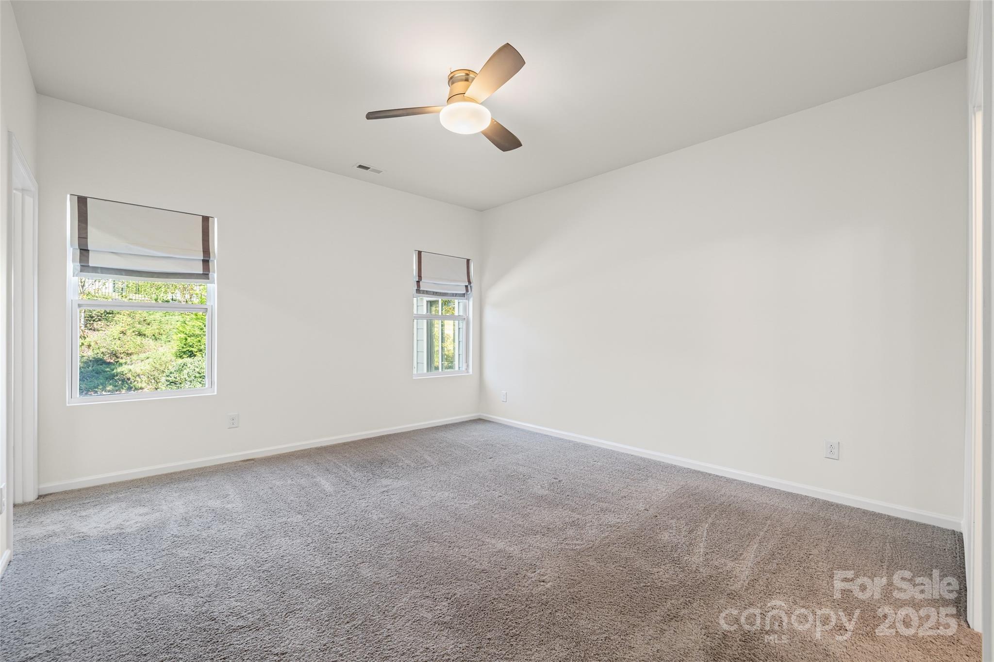 1214 Brookcrest Lane Fort Mill, SC 29708 - Photo 22 of 41 an empty room with ceiling fan and window