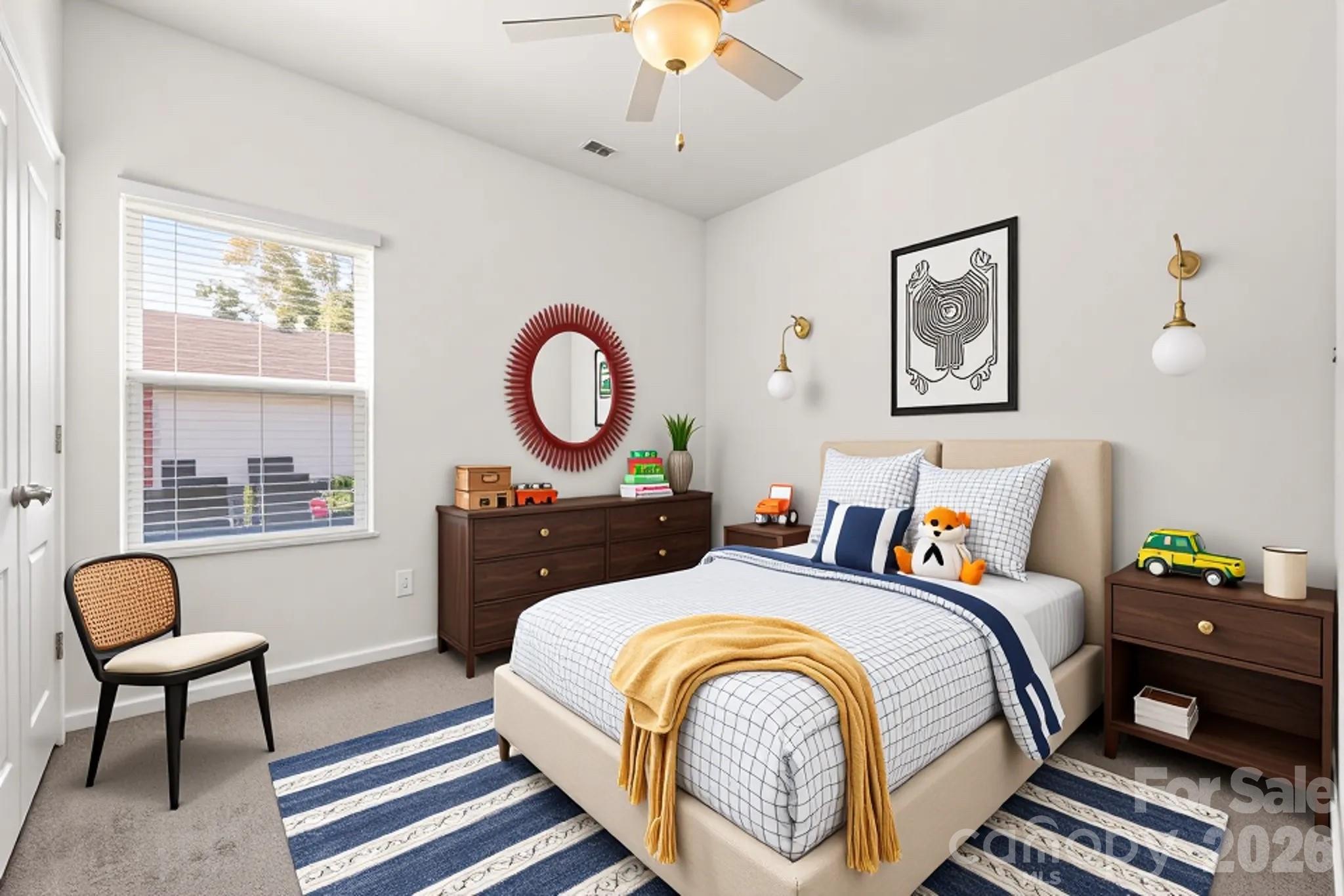 1214 Brookcrest Lane Fort Mill, SC 29708 - Photo 29 of 41 a bedroom with bed and a chandelier