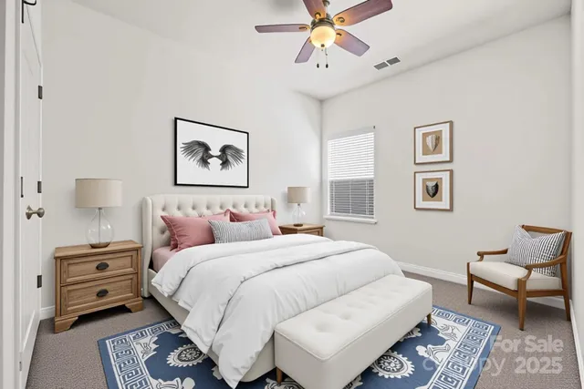 a bedroom with a bed and a couch