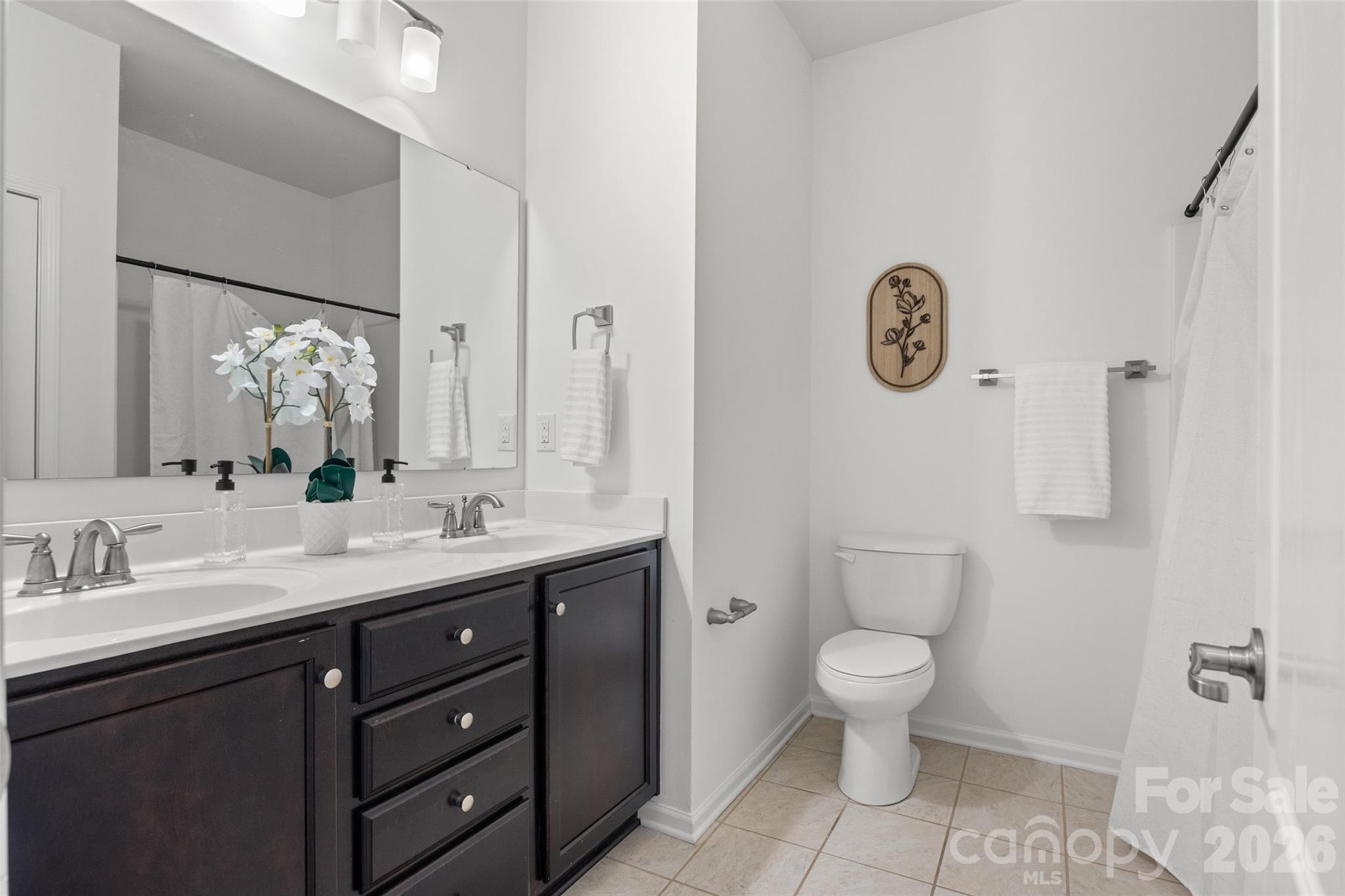 1214 Brookcrest Lane Fort Mill, SC 29708 - Photo 33 of 41 a bathroom with a toilet sink and mirror