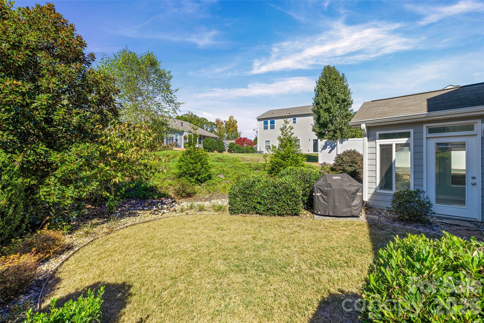 1214 Brookcrest Lane Fort Mill, SC 29708 - Photo 38 of 41 a view of a house with potted plants and a large tree