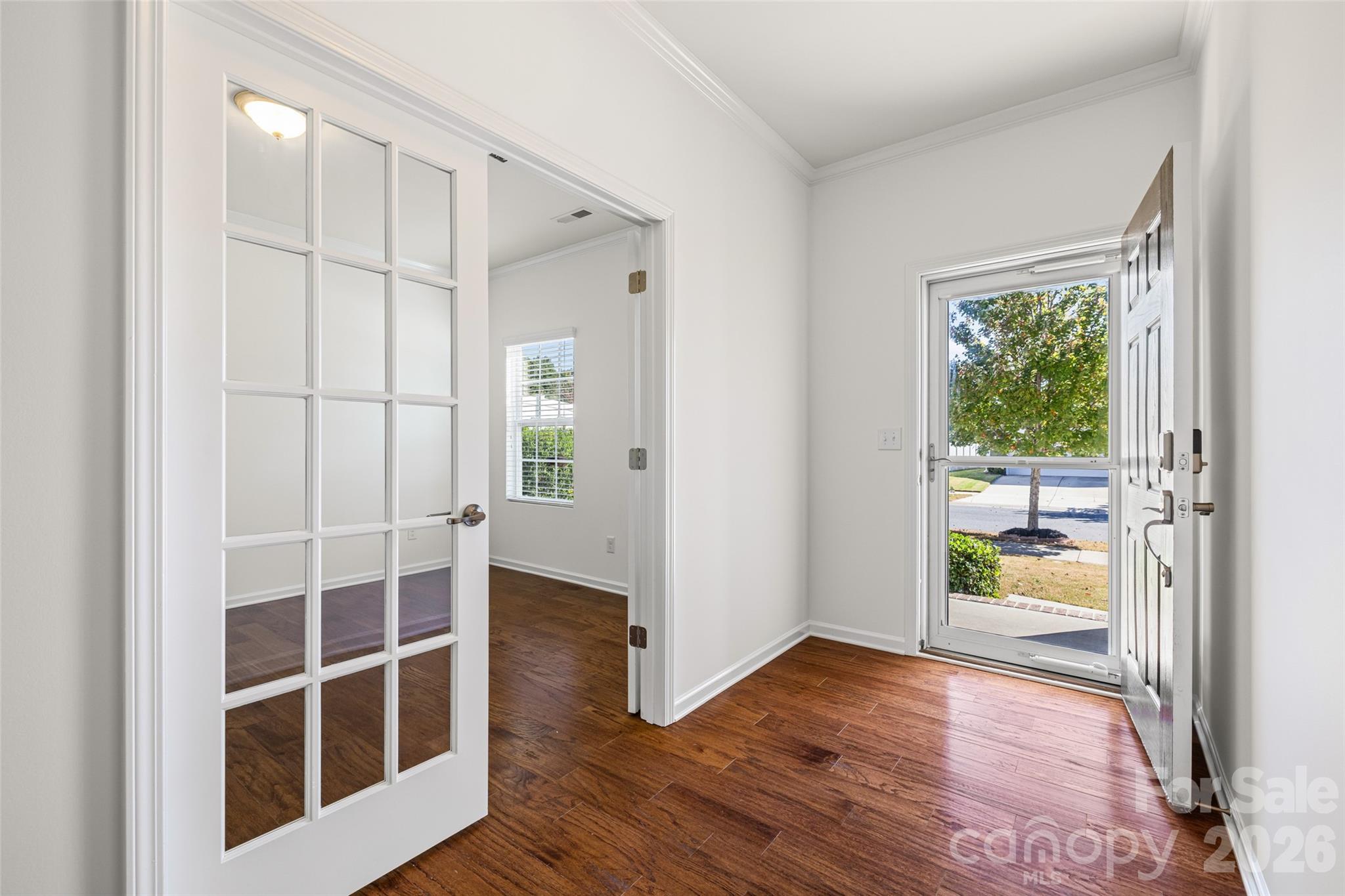 1214 Brookcrest Lane Fort Mill, SC 29708 - Photo 7 of 41 a view of an empty room with wooden floor and a window
