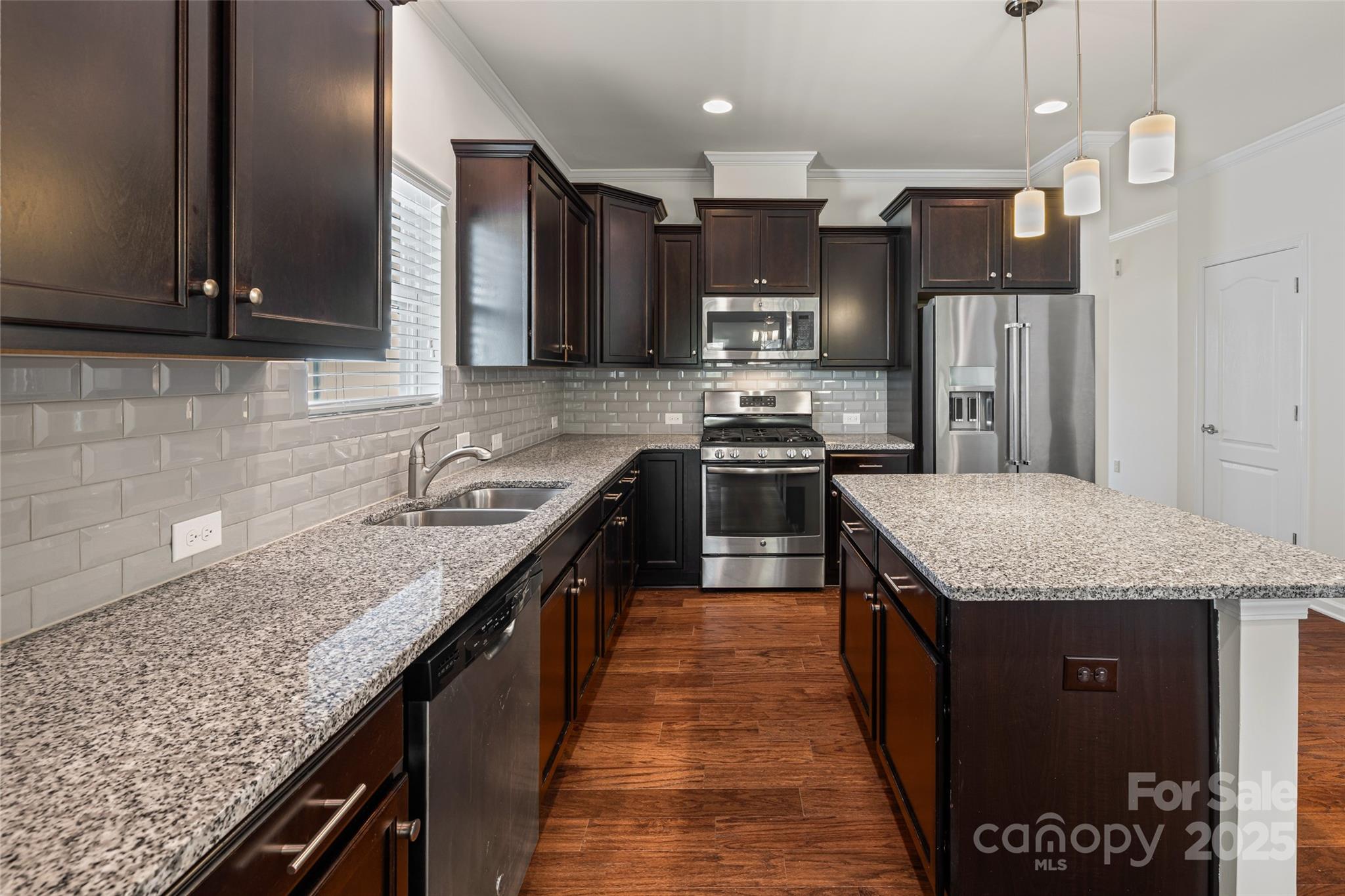 1214 Brookcrest Lane Fort Mill, SC 29708 - Photo 10 of 41 a kitchen with stainless steel appliances granite countertop a sink stove and refrigerator