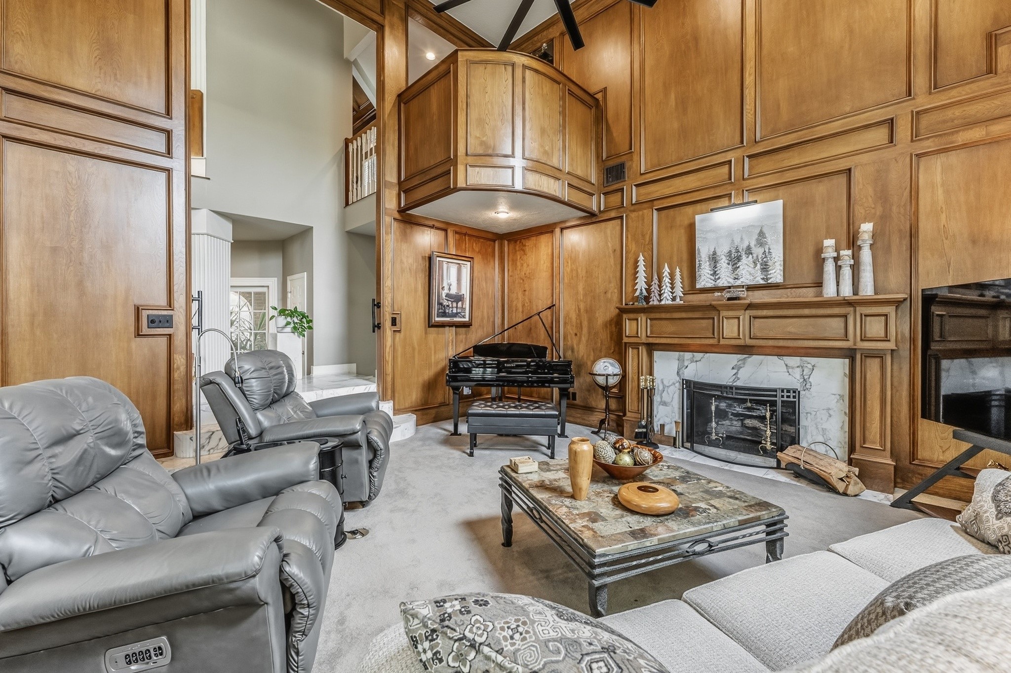 6047 Spring Creek Lane Spring, TX 77379 - Photo 4 of 50 Detailed woodwork, soaring proportions, and a statement gaslog fireplace give the space a refined sense of character rooted in classic design. Bathed in natural light, the room balances grandeur with an easy, lived in comfort.