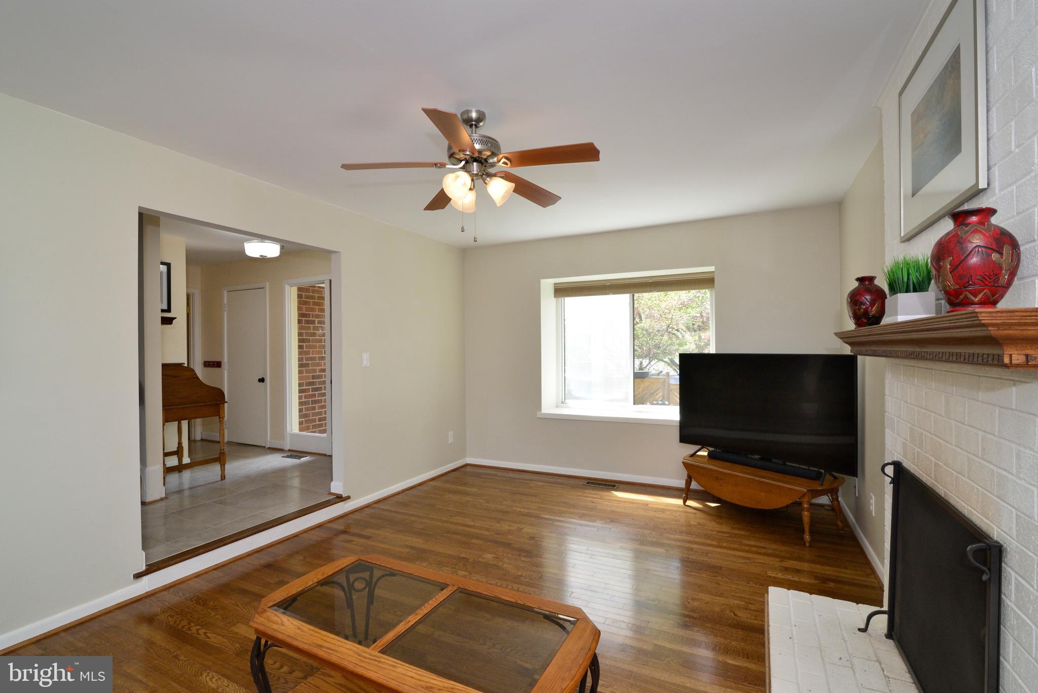 11086 Glade Court Reston, VA 20191 - Photo 9 of 44 The foyer opens to the living room with hardwoods