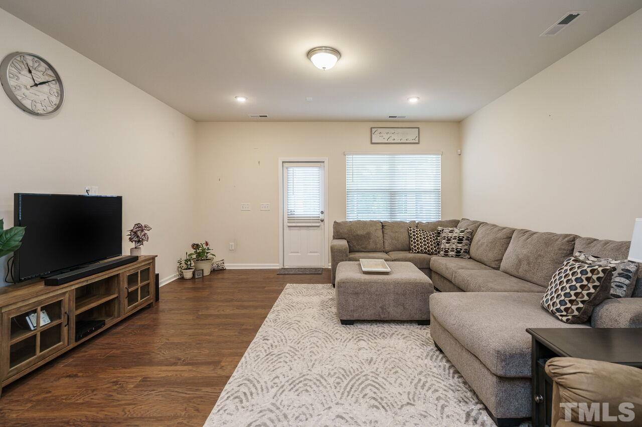 4100 Catfish Wy. Durham, NC 27703 - Photo 14 of 29 a living room with furniture and a flat screen tv