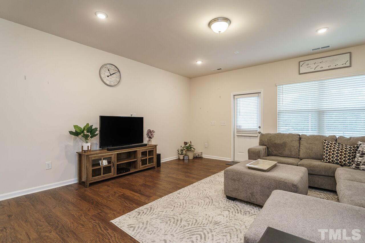 4100 Catfish Wy. Durham, NC 27703 - Photo 15 of 29 a living room with furniture and a flat screen tv