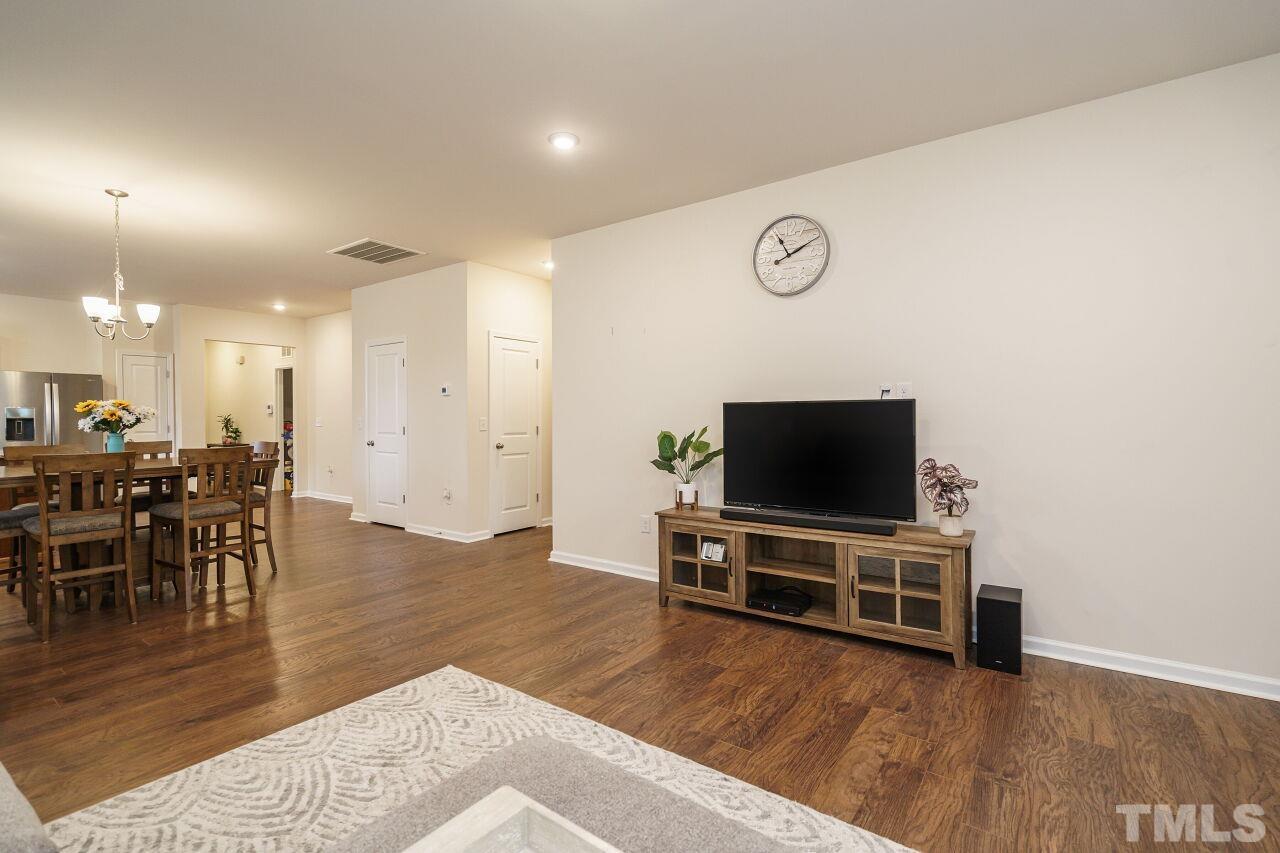 4100 Catfish Wy. Durham, NC 27703 - Photo 16 of 29 a living room with furniture and a flat screen tv