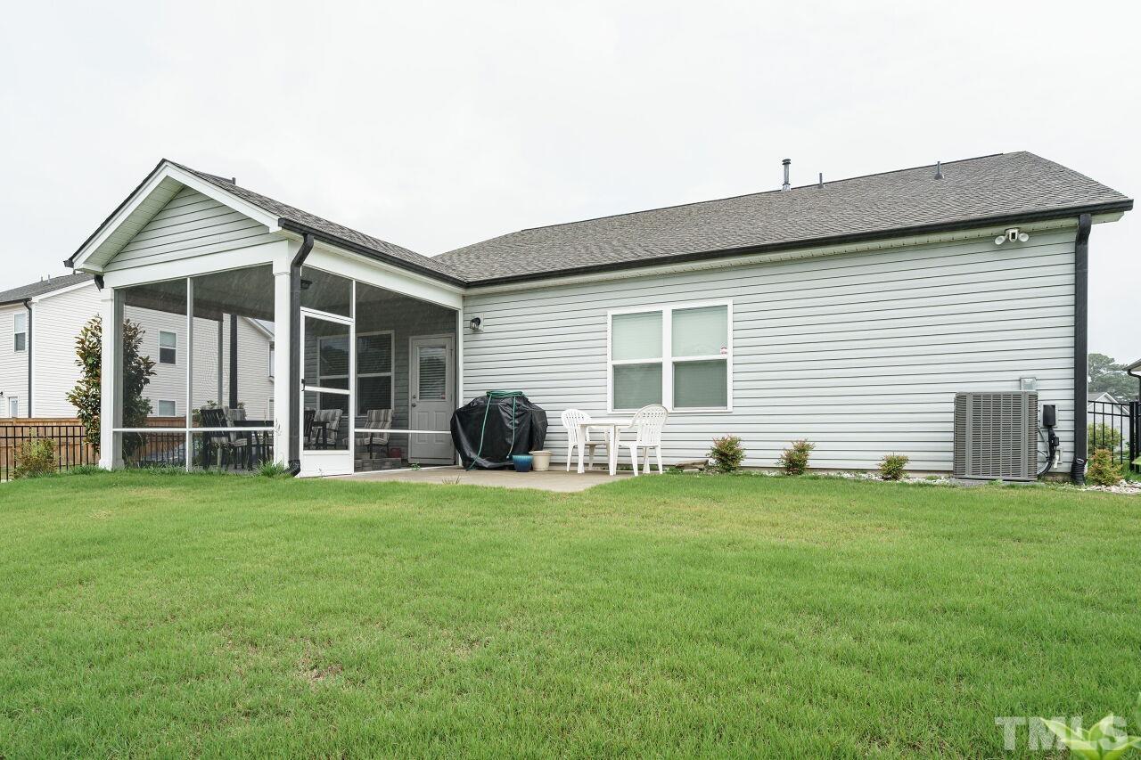 4100 Catfish Wy. Durham, NC 27703 - Photo 26 of 29 a view of a house with backyard and porch
