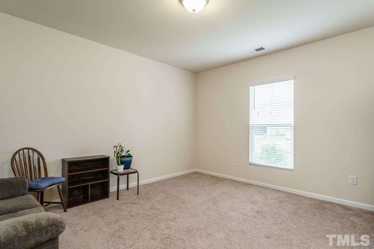 4100 Catfish Wy. Durham, NC 27703 - Photo 5 of 29 a livingroom with workspace and a window