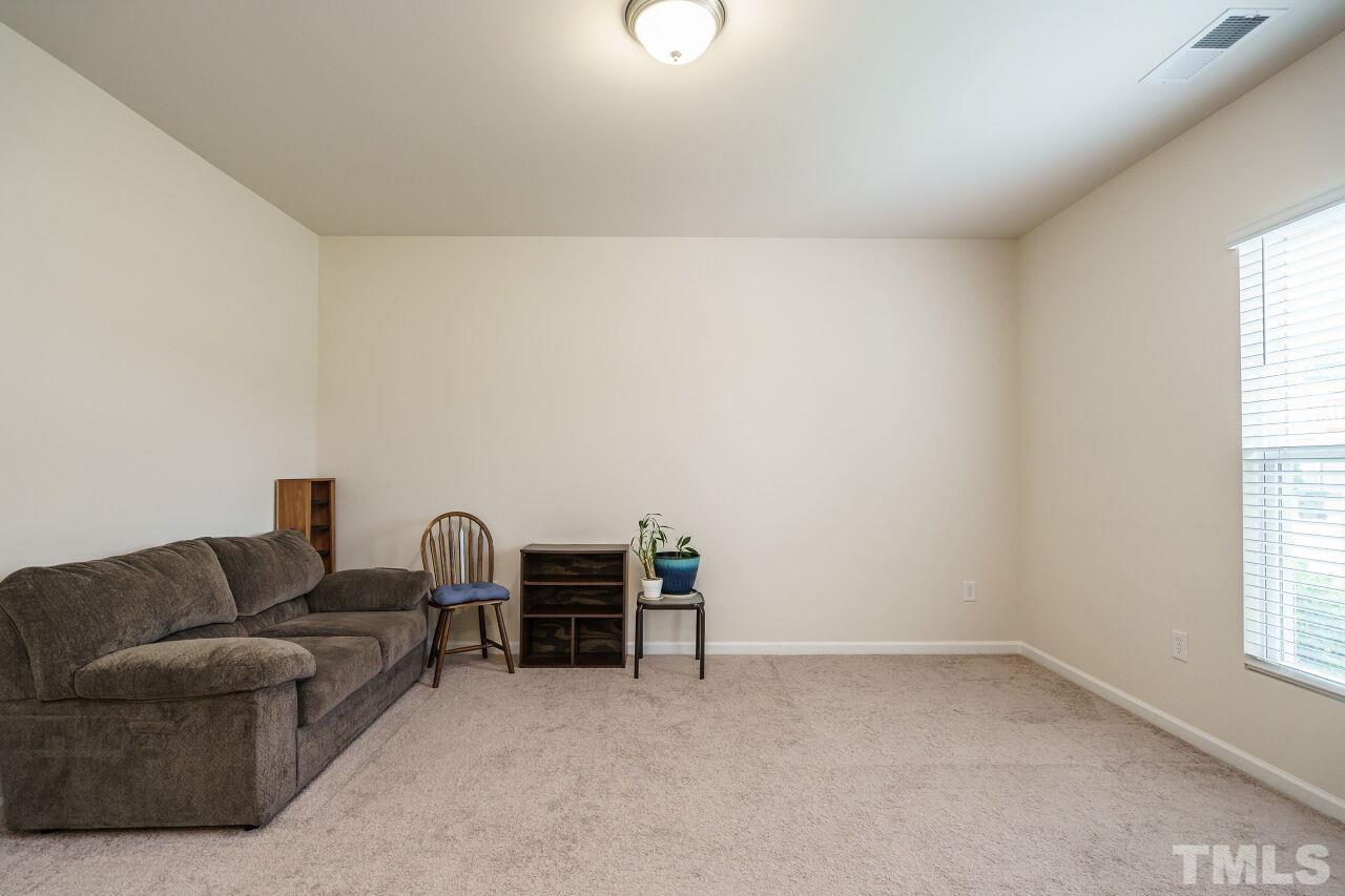 4100 Catfish Wy. Durham, NC 27703 - Photo 7 of 29 a living room with furniture and a window