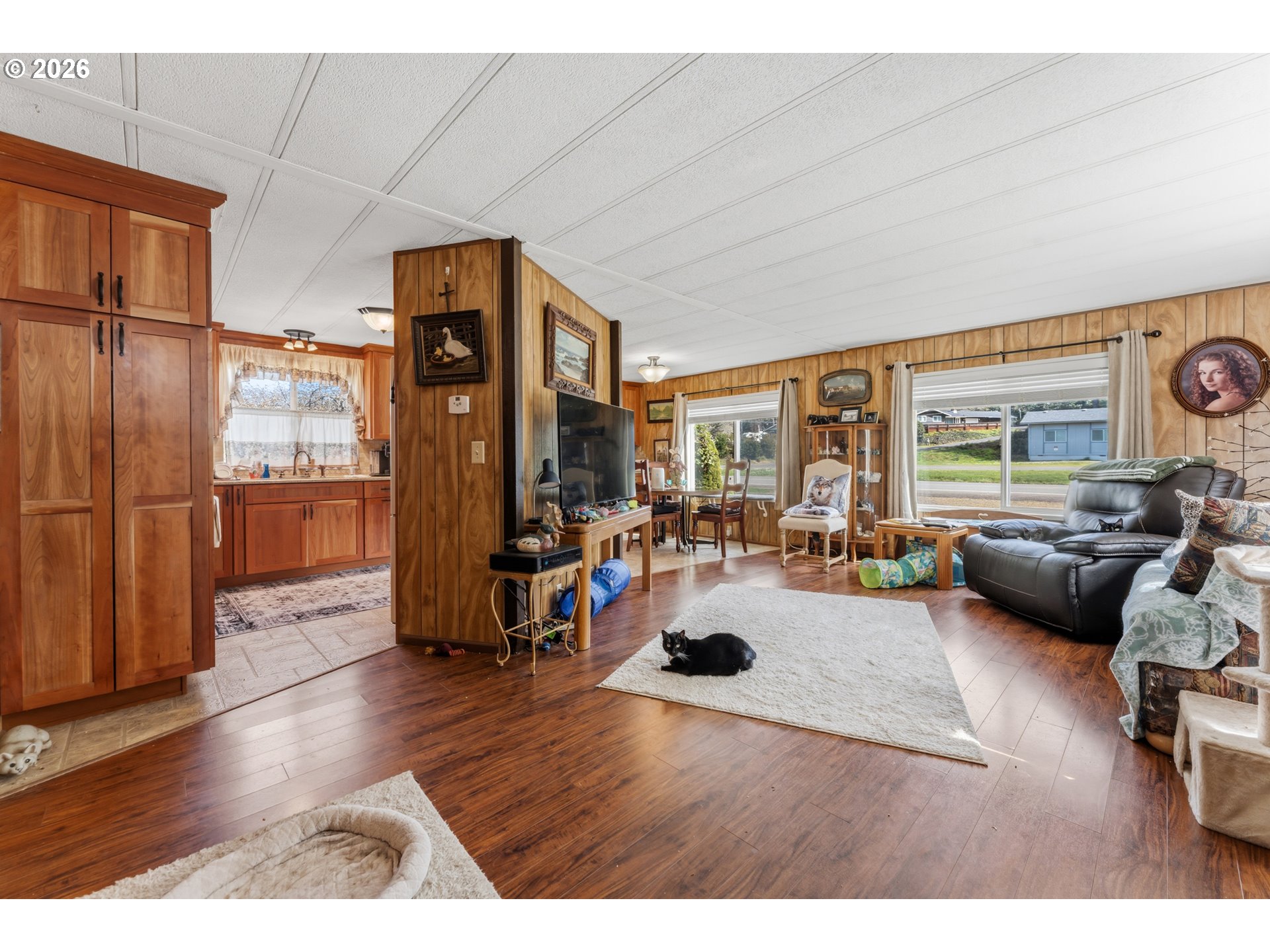 735 North 8th Street Lakeside, OR 97449 - Photo 11 of 45 a living room with furniture and a large window