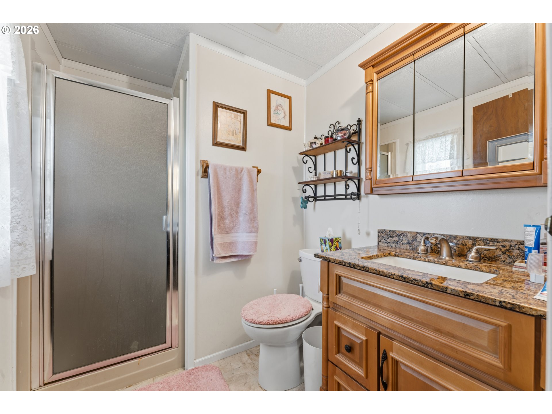 735 North 8th Street Lakeside, OR 97449 - Photo 29 of 45 a bathroom with a sink a toilet and shower