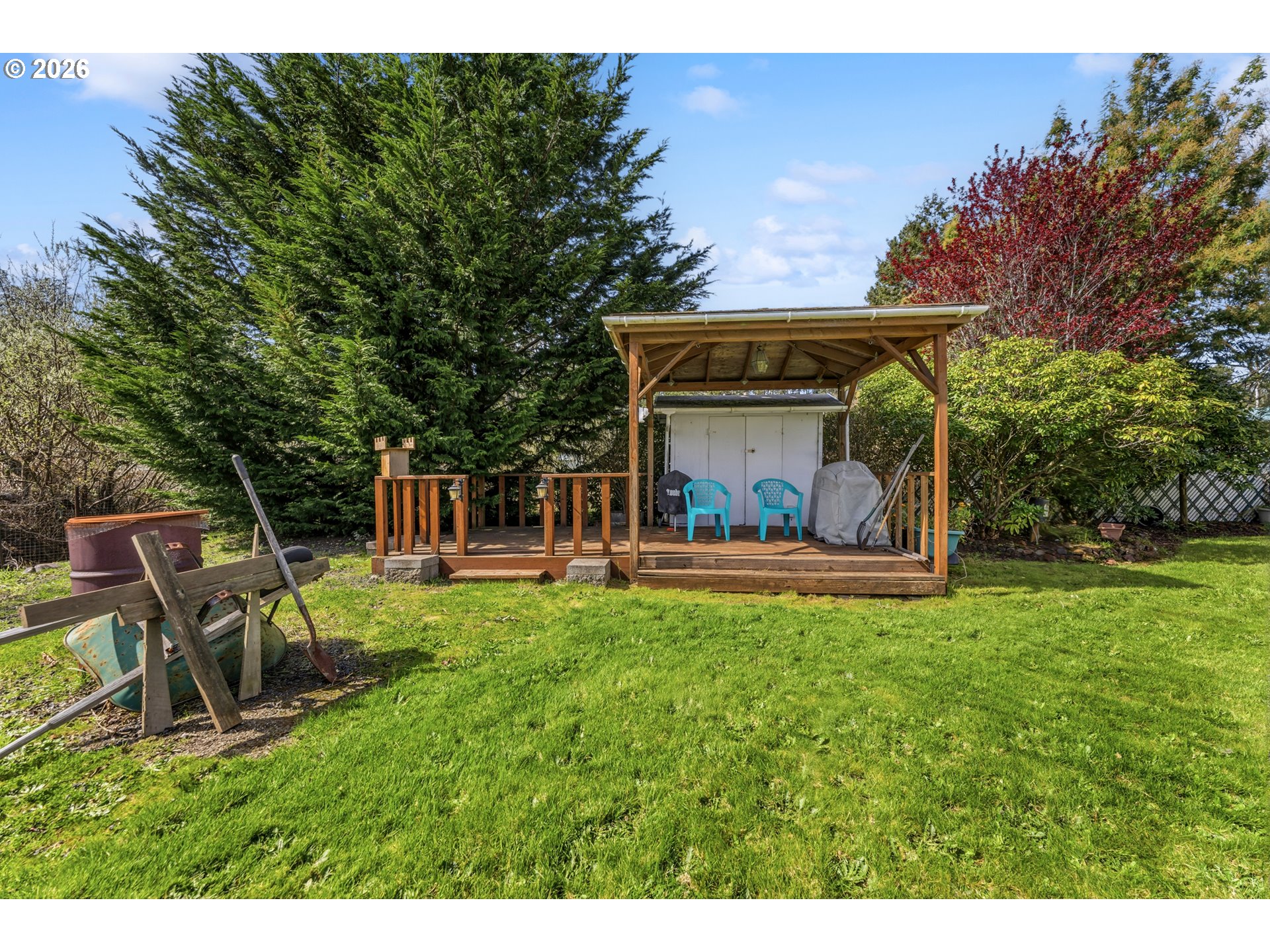 735 North 8th Street Lakeside, OR 97449 - Photo 35 of 45 a view of a porch with furniture and a garden