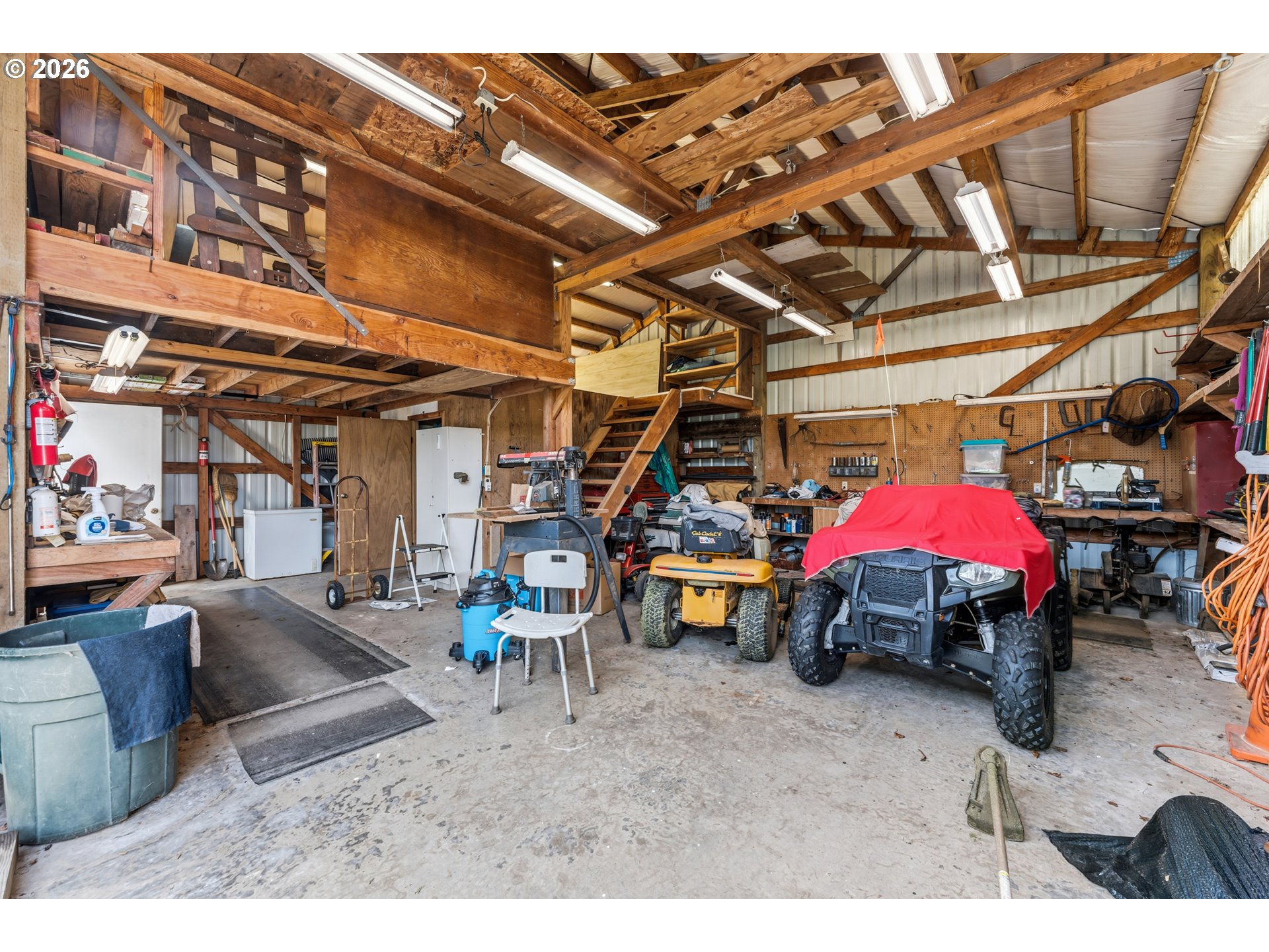 735 North 8th Street Lakeside, OR 97449 - Photo 39 of 45 a view of garage with a table and chairs