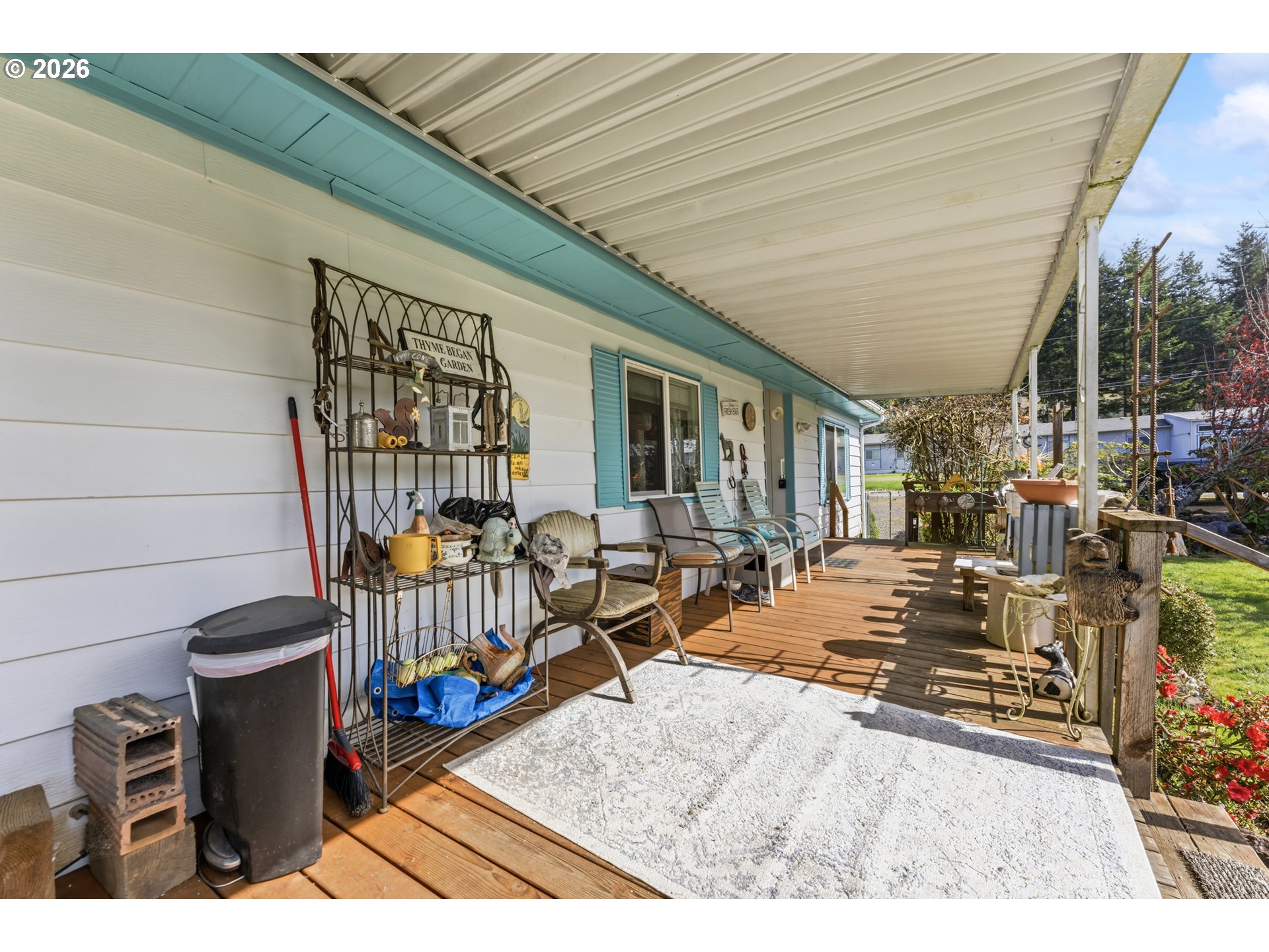735 North 8th Street Lakeside, OR 97449 - Photo 5 of 45 a view of a patio with couches chairs and wooden floor