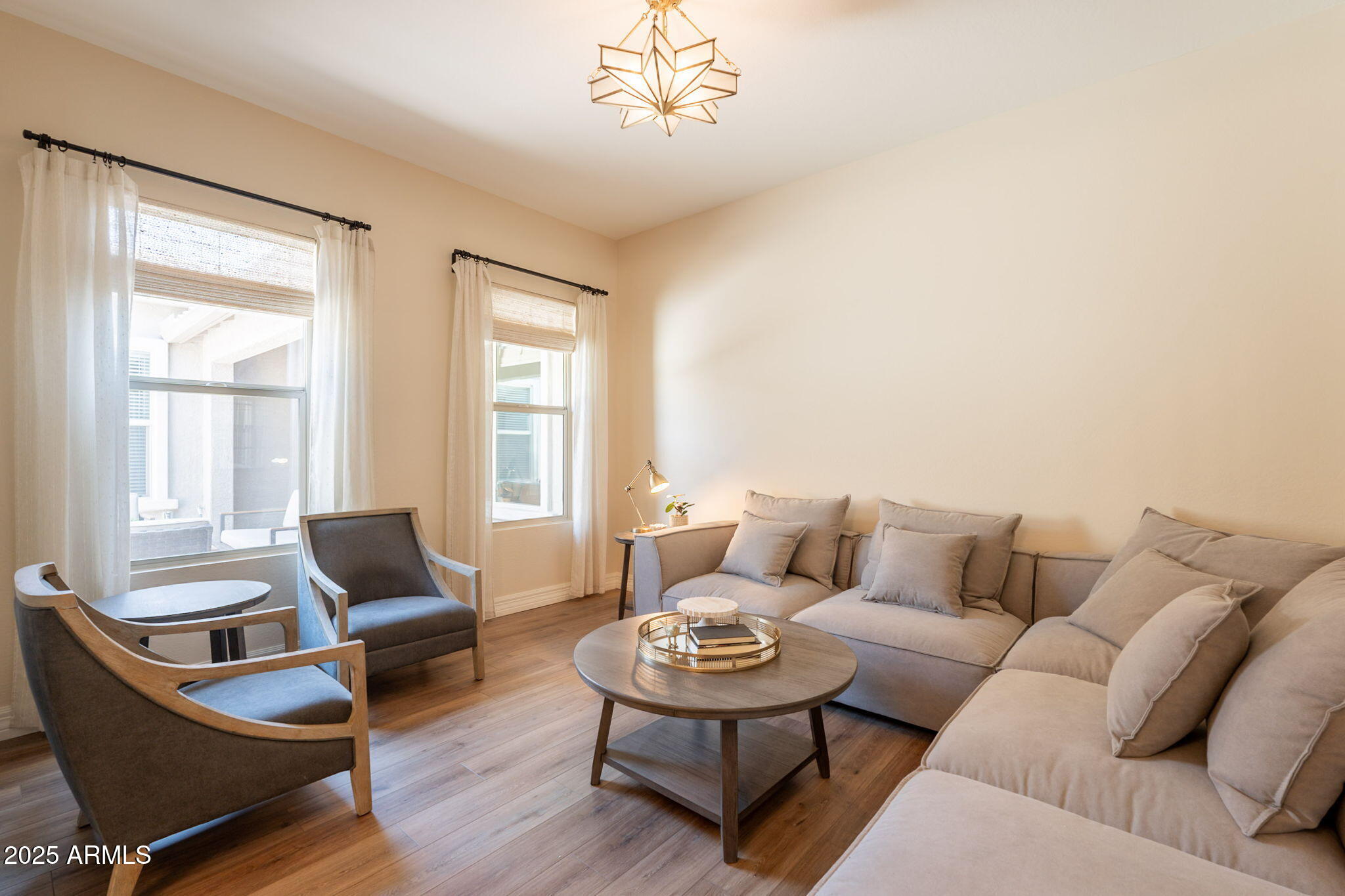 22863 East Russet Road Queen Creek, AZ 85142 - Photo 10 of 77 a living room with furniture and a large window