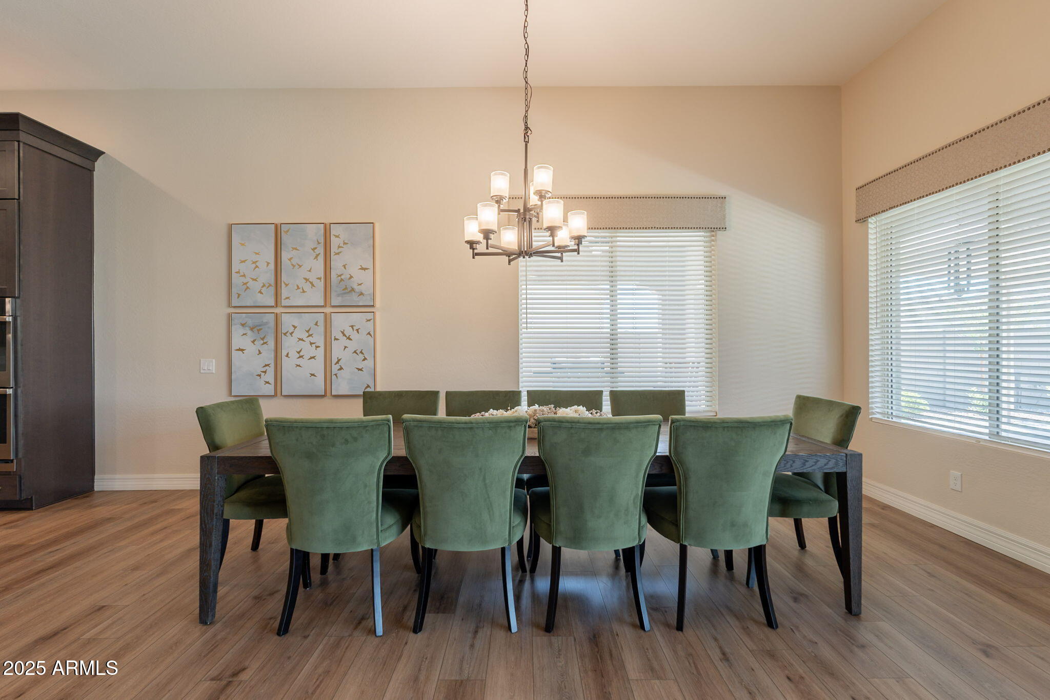 22863 East Russet Road Queen Creek, AZ 85142 - Photo 16 of 77 a view of a dining room with furniture and wooden floor