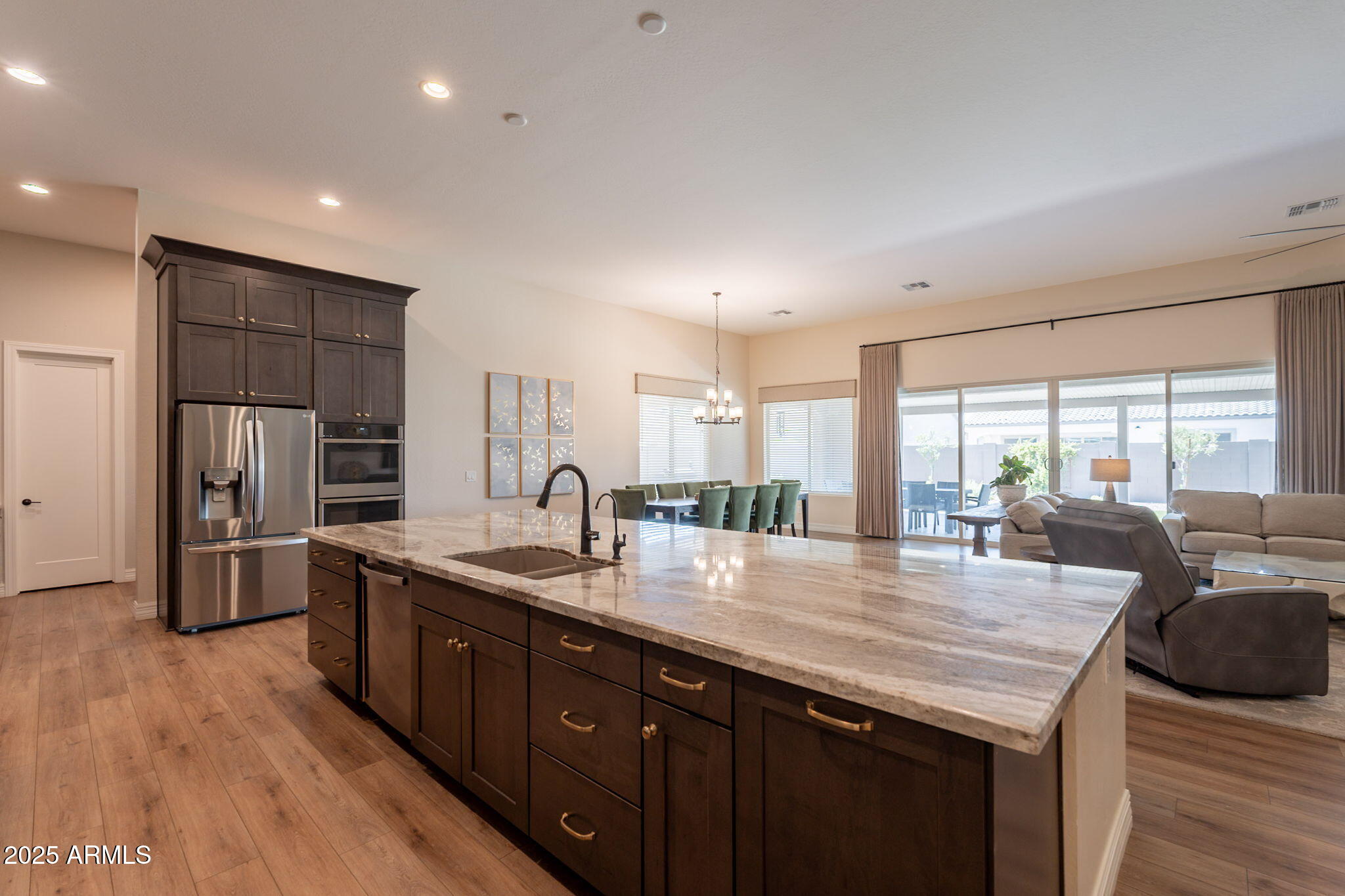 22863 East Russet Road Queen Creek, AZ 85142 - Photo 19 of 77 a kitchen with stainless steel appliances granite countertop a sink a stove and a refrigerator
