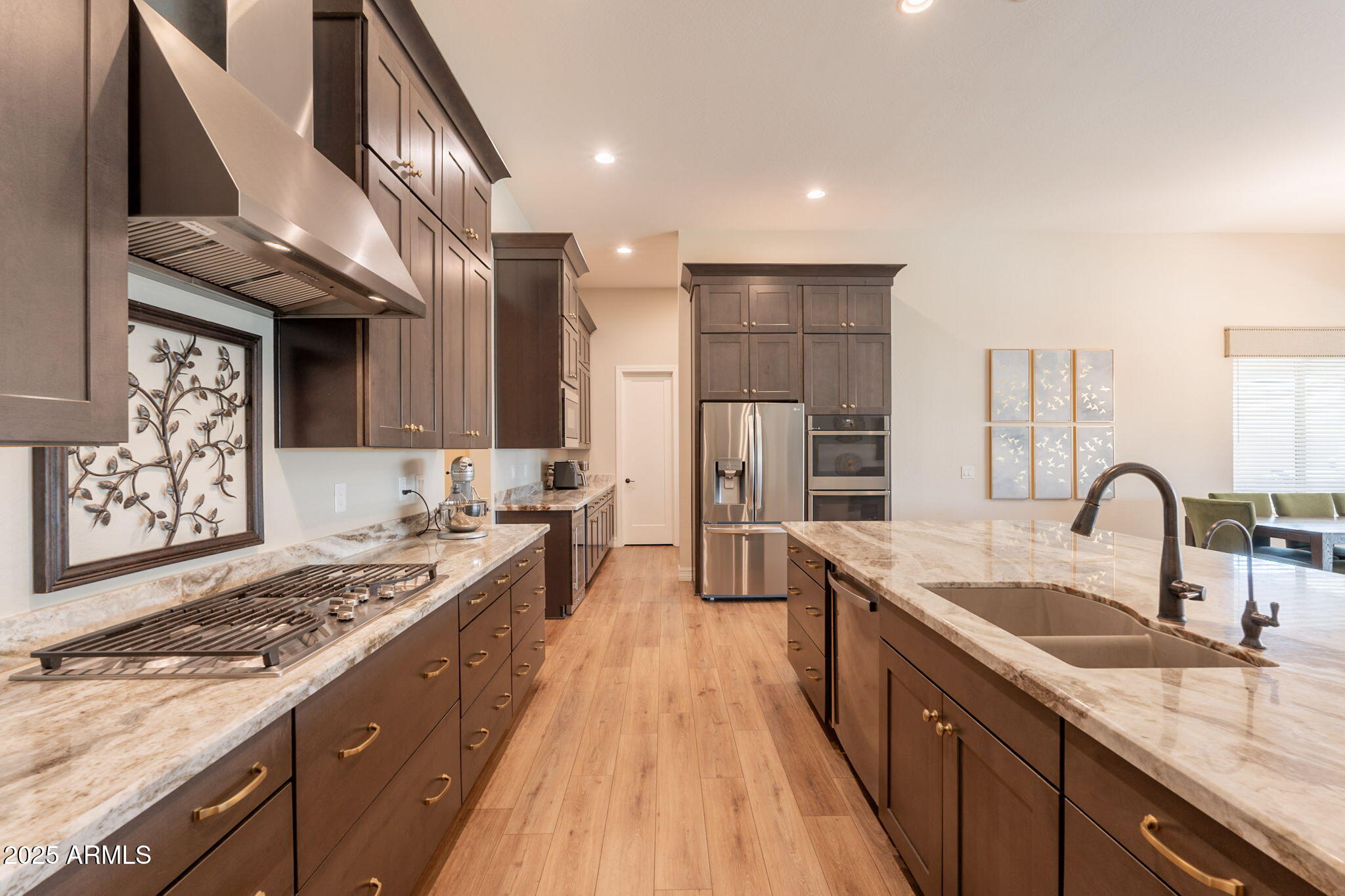 22863 East Russet Road Queen Creek, AZ 85142 - Photo 24 of 77 a kitchen with stainless steel appliances granite countertop a sink stove and refrigerator