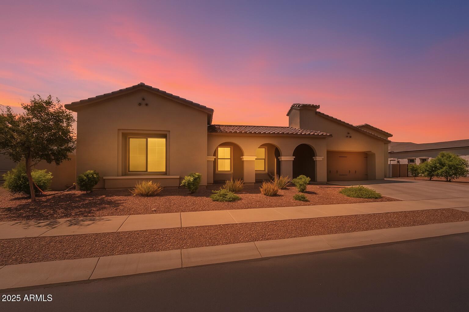 22863 East Russet Road Queen Creek, AZ 85142 - Photo 2 of 77 a front view of a house with garden