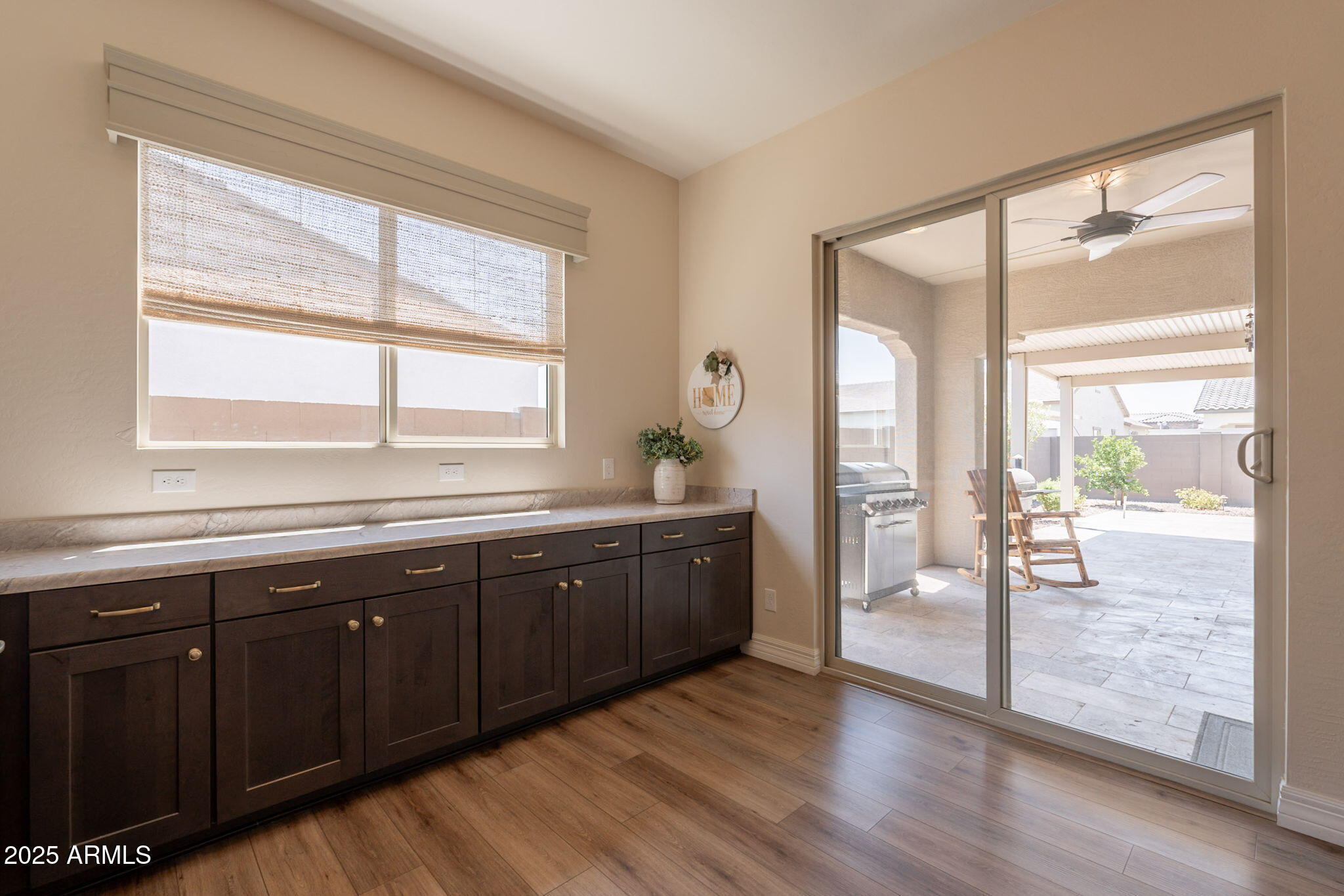 22863 East Russet Road Queen Creek, AZ 85142 - Photo 30 of 77 a spacious bathroom with a granite countertop sink and a large mirror
