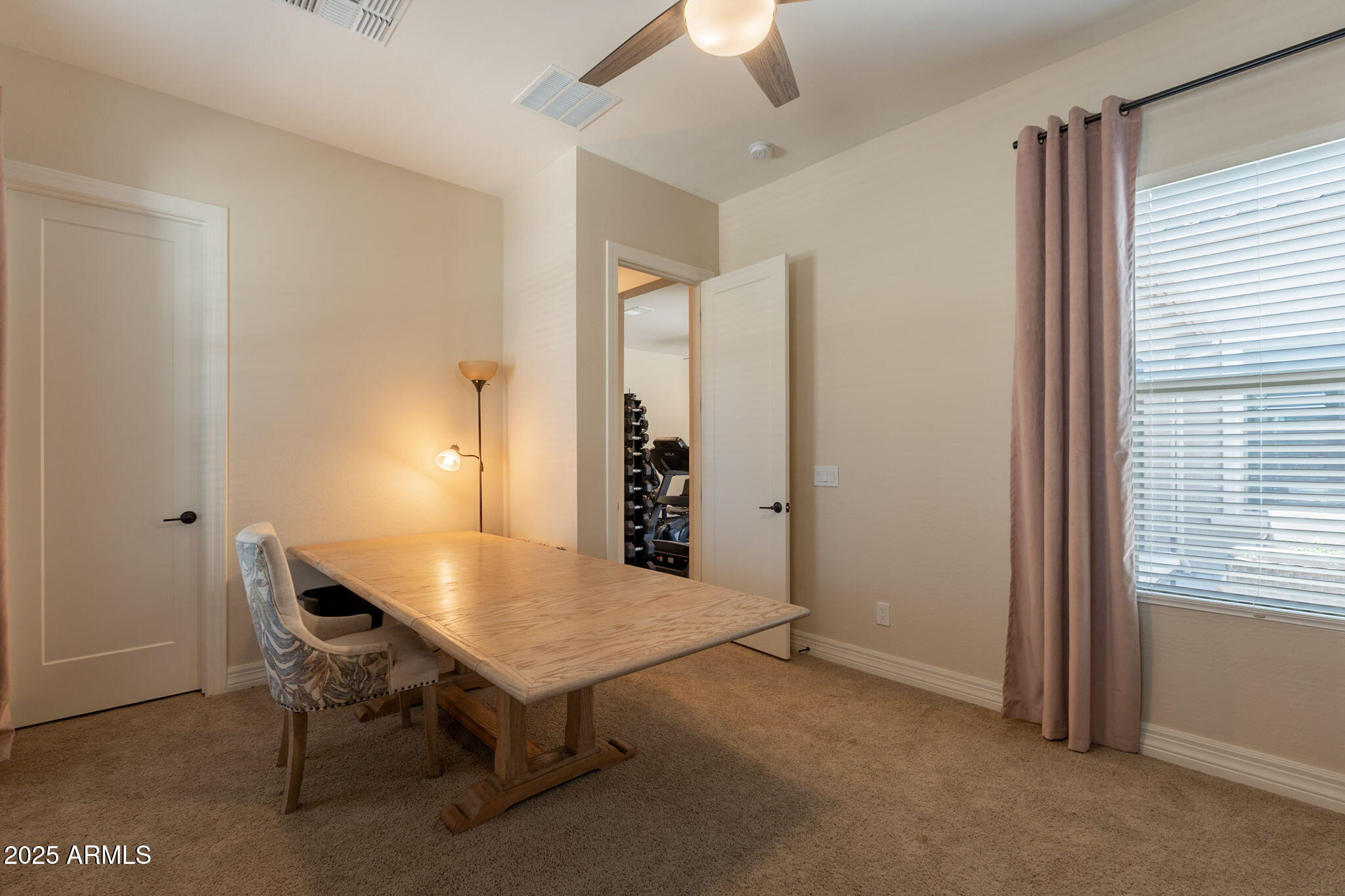 22863 East Russet Road Queen Creek, AZ 85142 - Photo 40 of 77 a view of a workspace with furniture and a window