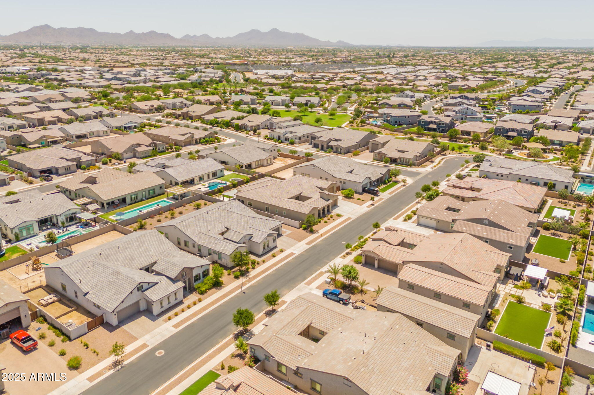 22863 East Russet Road Queen Creek, AZ 85142 - Photo 66 of 77 an aerial view of residential building and lake view