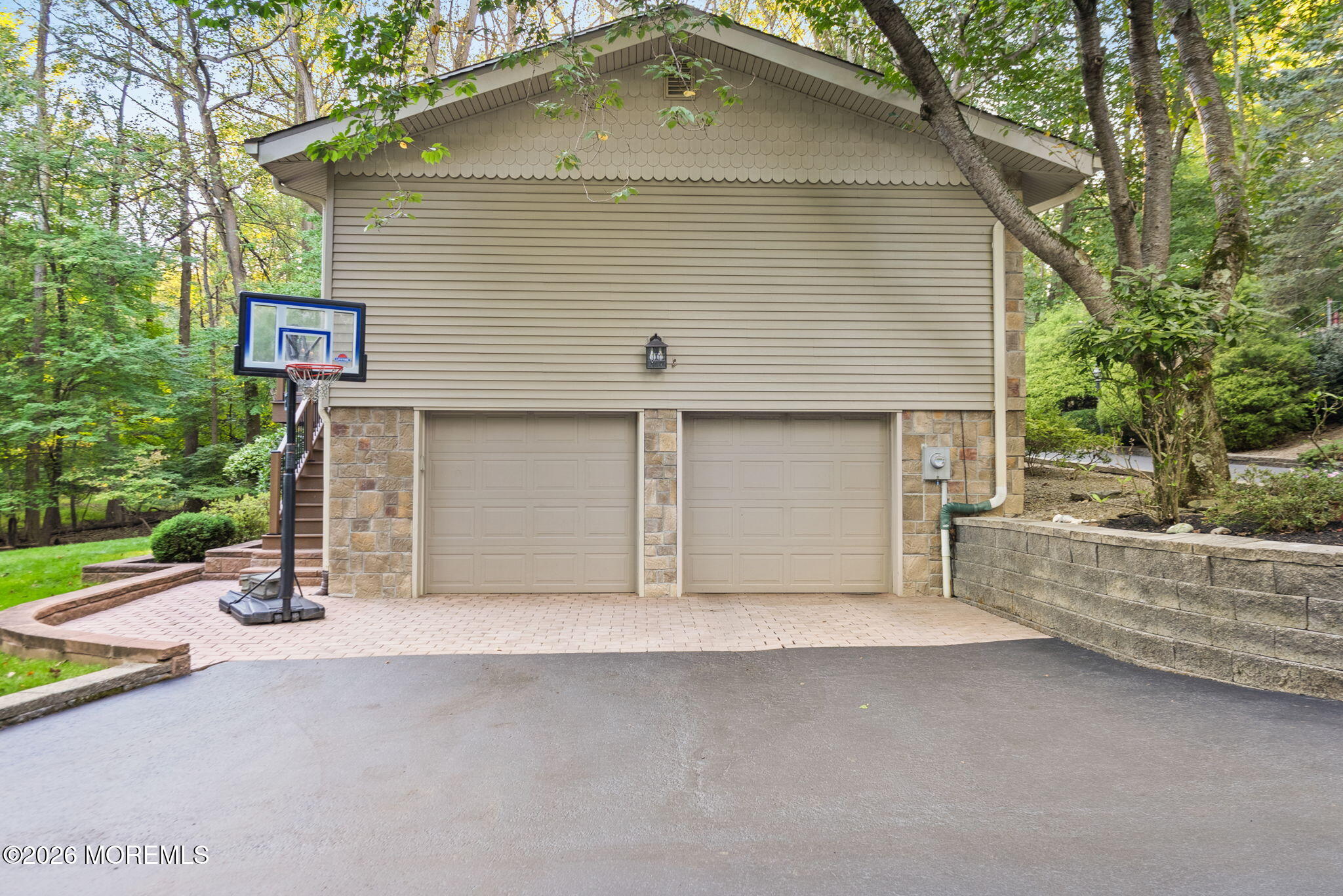 21 Stoney Brook Road Holmdel, NJ 07733 - Photo 32 of 40 a front view of a house with a yard and garage