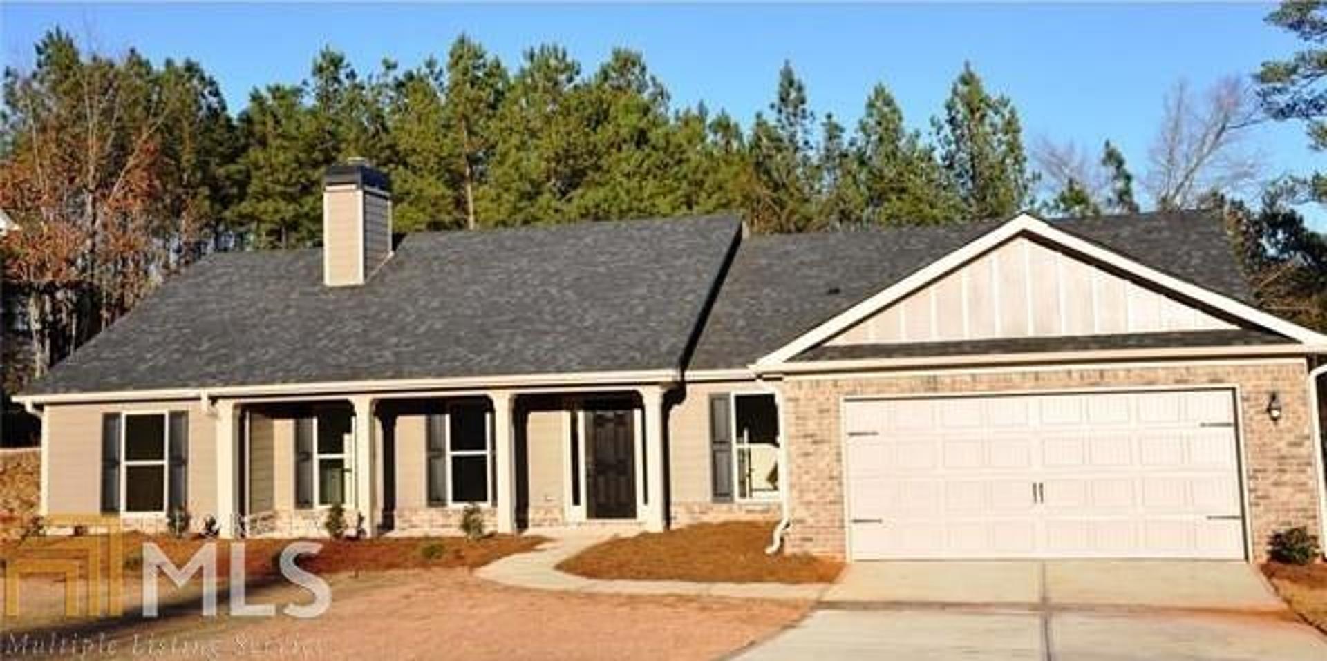 104 Powers Road, Unit 6 Monroe, GA 30655 - Photo 1 of 1 a view of a house with a backyard