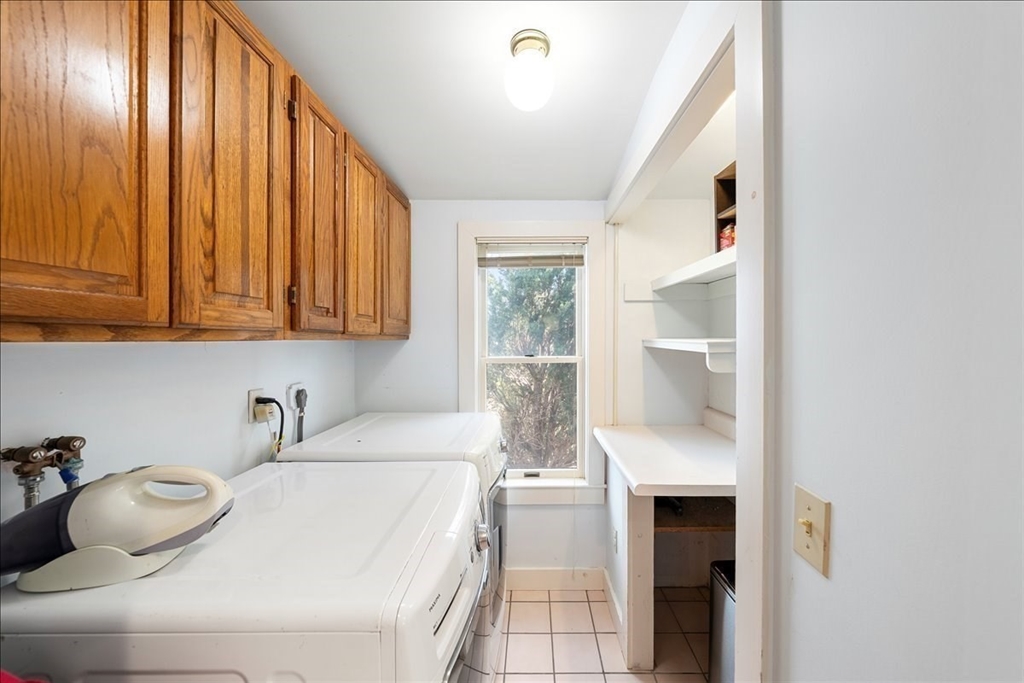 10 2nd Street Natick, MA 01760 - Photo 26 of 31 a hallway with a sink and cabinets
