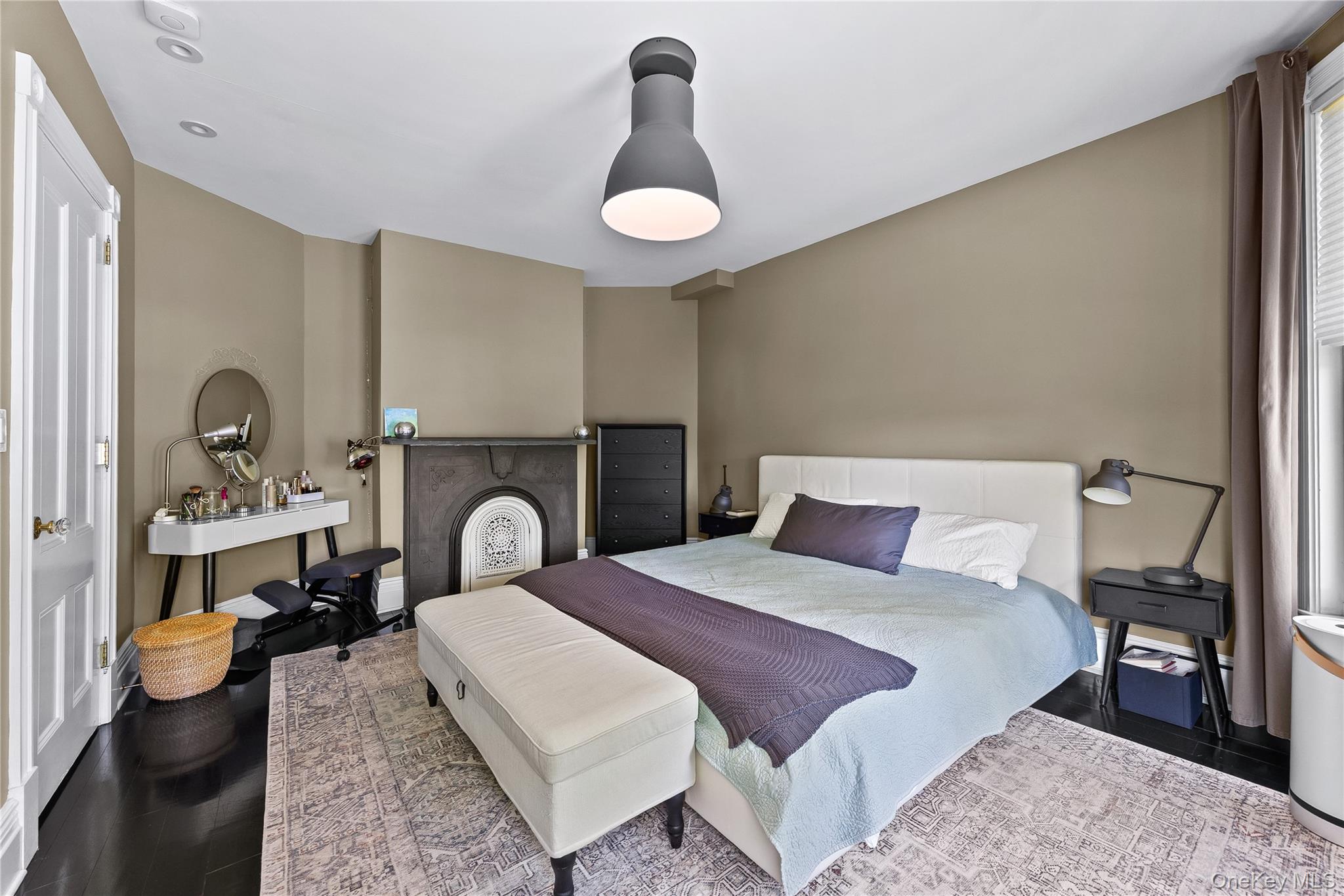 19 Howe Place Bronxville, NY 10708 - Photo 19 of 37 Bedroom featuring dark wood-finish flooring, a decorative fireplace with an ornate insert, recessed lighting, and a contemporary ceiling fixture