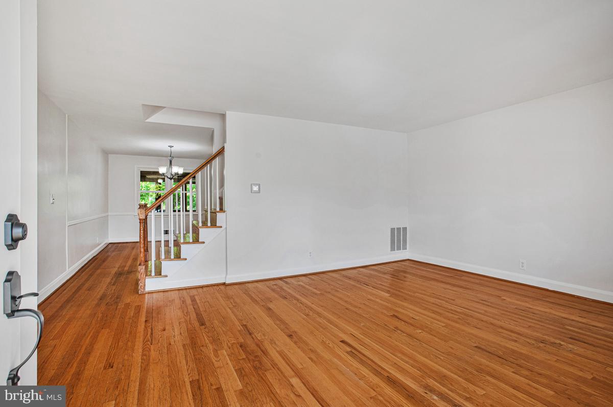 1016 Winsford Road Towson, MD 21204 - Photo 4 of 42 a view of a hallway with wooden floor