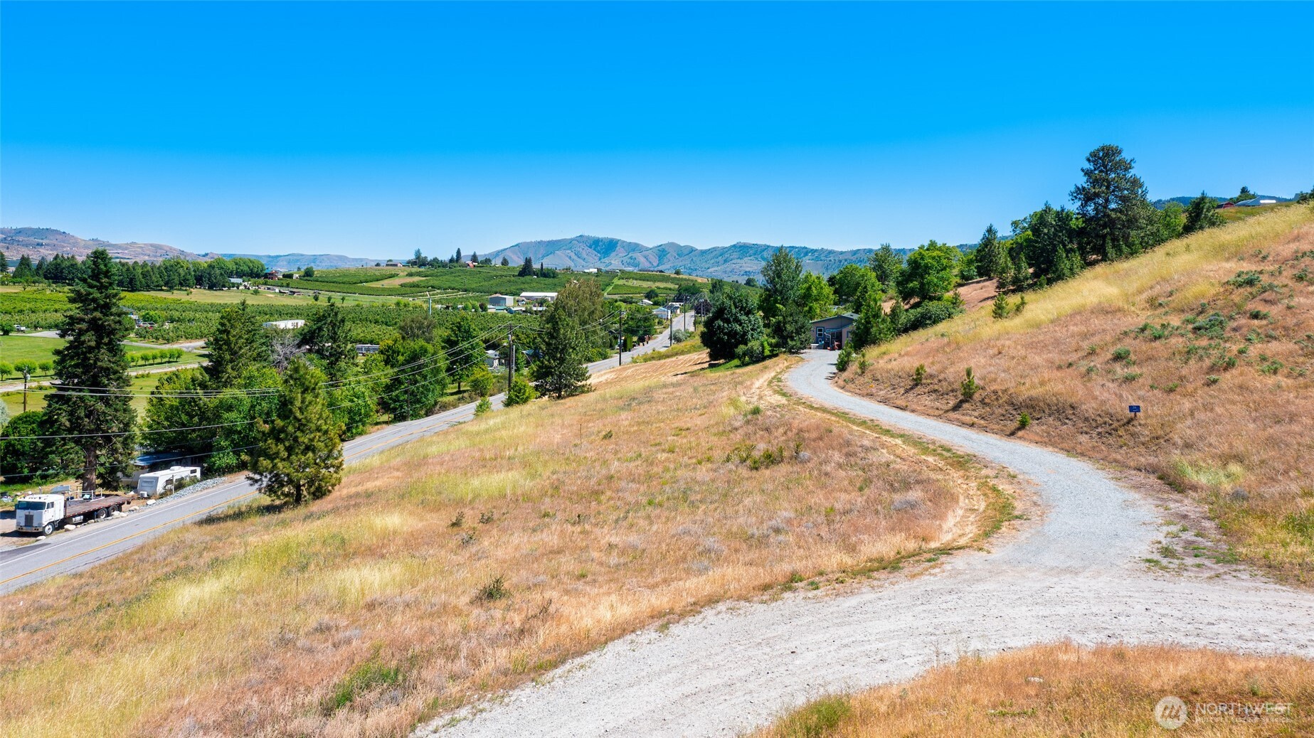 32 Barkley Road Manson, WA 98831 - Photo 14 of 17 a view of a road with a yard