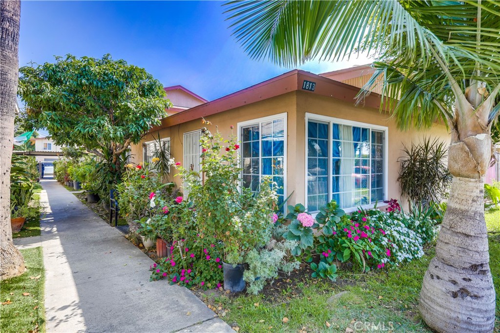 1813 Cedar Street Santa Ana, CA 92707 - Photo 4 of 6 a view of a house with a flower garden