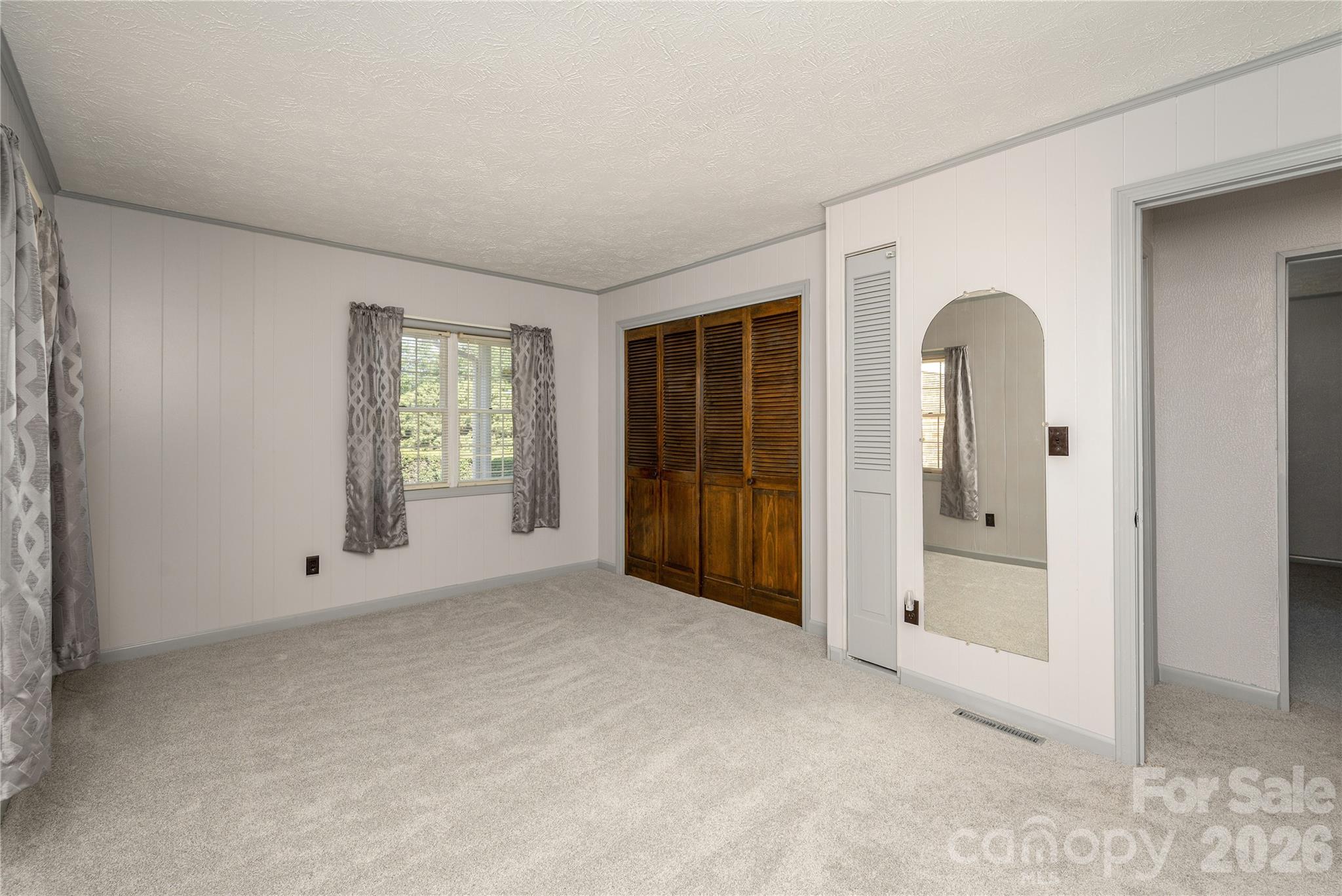 231 Allen Road East Flat Rock, NC 28726 - Photo 24 of 42 an empty room with windows