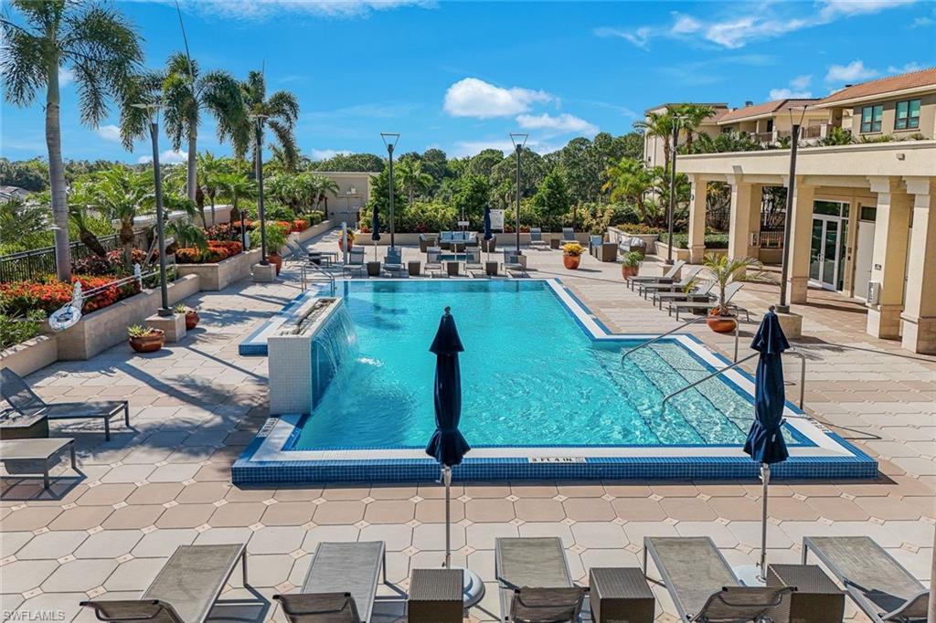 9123 Strada Place, Unit 7201 Naples, FL 34108 - Photo 41 of 50 a view of a swimming pool with a patio and plants