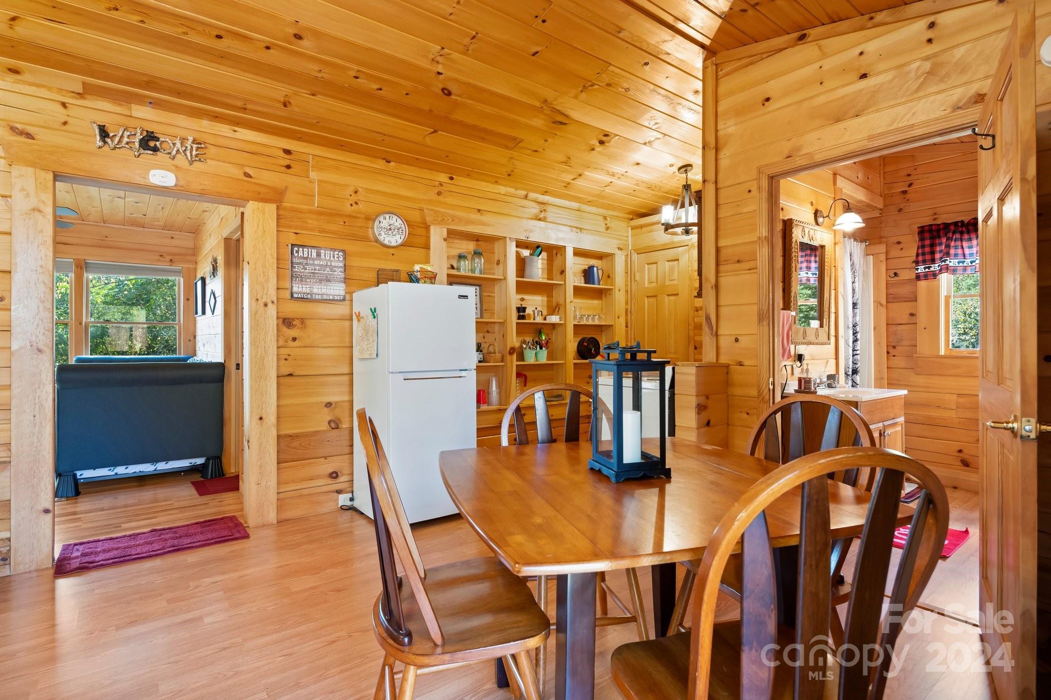 64 Bennett Road Candler, NC 28715 - Photo 8 of 24 a dining room with furniture and wooden floor