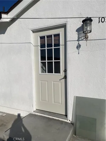a kitchen with granite countertop a refrigerator and a stove