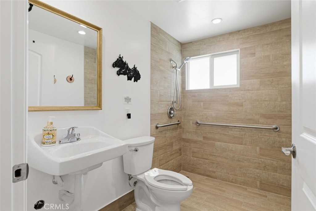 301 West Ashby Street Azusa, CA 91702 - Photo 28 of 75 a bathroom with a sink toilet and shower