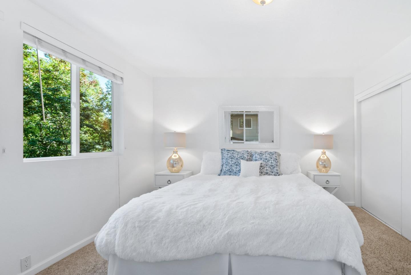 115 Shadowbrook Road Ben Lomond, CA 95005 - Photo 12 of 51 a bedroom with a bed and a window