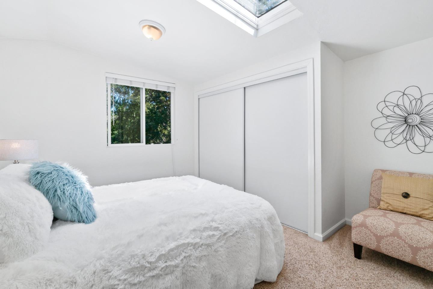 115 Shadowbrook Road Ben Lomond, CA 95005 - Photo 17 of 51 a bedroom with a bed and a window