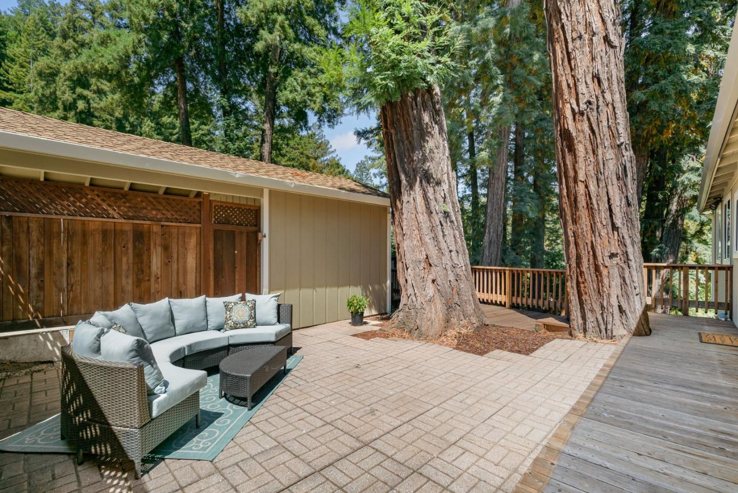 115 Shadowbrook Road Ben Lomond, CA 95005 - Photo 20 of 51 a view of backyard with a table and chair with wooden floor and fence