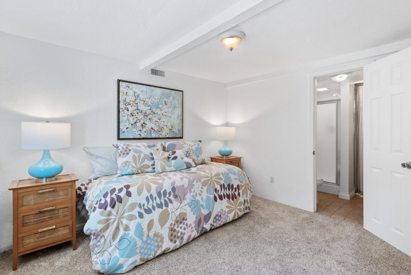 115 Shadowbrook Road Ben Lomond, CA 95005 - Photo 29 of 51 a bedroom with a bed and a lamp on dresser