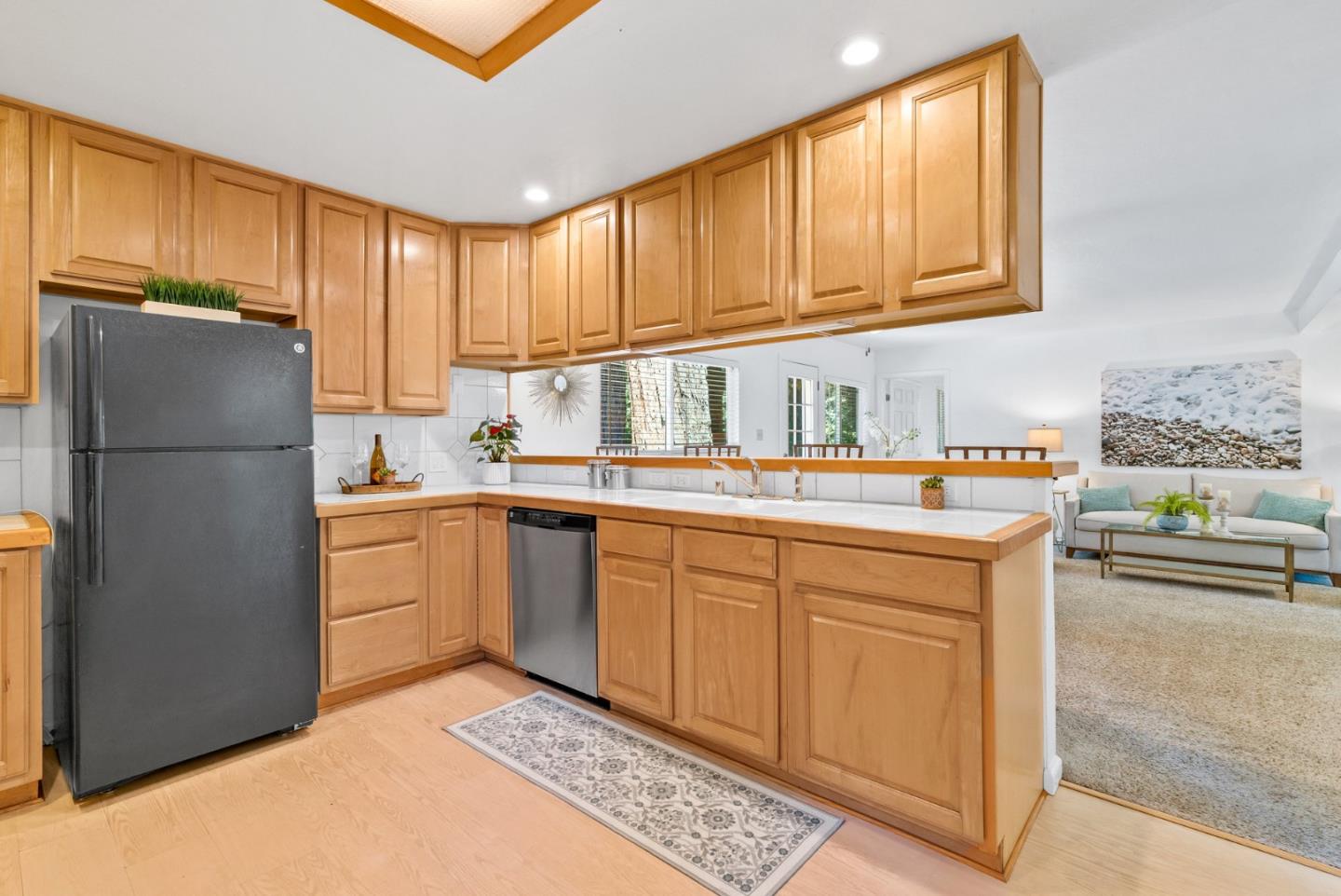 115 Shadowbrook Road Ben Lomond, CA 95005 - Photo 7 of 51 a kitchen with stainless steel appliances granite countertop a refrigerator sink and cabinets