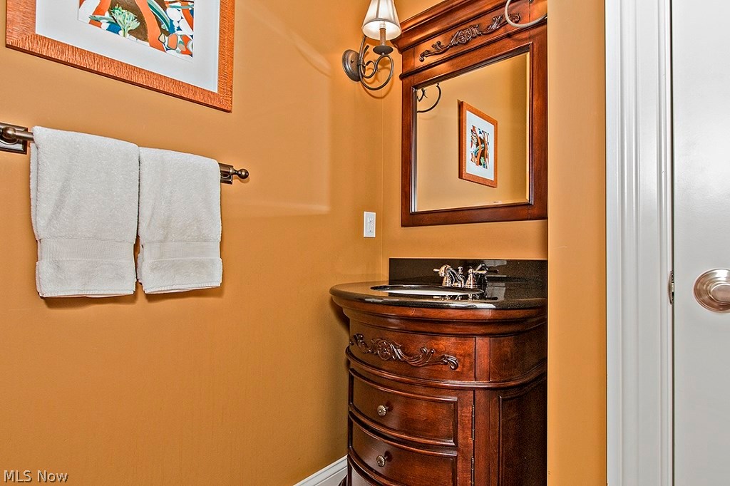 3375 Legends Way Cleveland, OH 44124 - Photo 27 of 33 Powder Room with Custom Cabinetry and Granite Counter Top