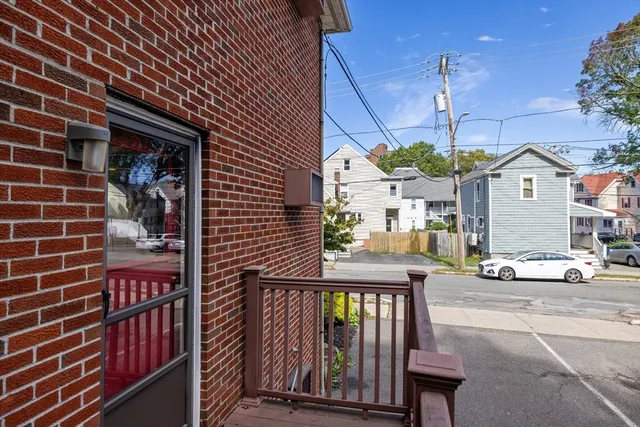 a view of a brick house with a street